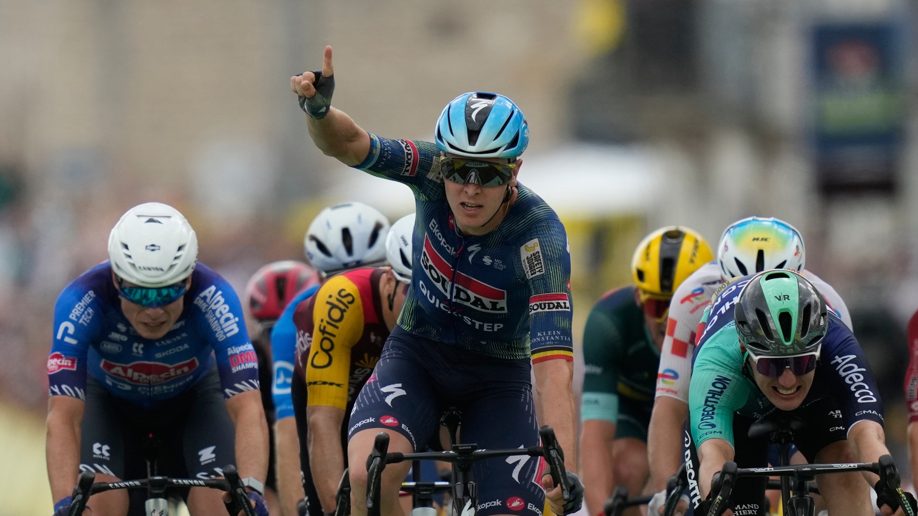 Belgium's Tim Merlier celebrates as he crosses the finish line to win the twelfth stage of the Tour de France cycling race with start in Circuit Nevers Magny-Cours and finish in Chalon-sur-Saone, France, Thursday, July 16, 2026. (AP Photo/Mosa'ab Elshamy)
