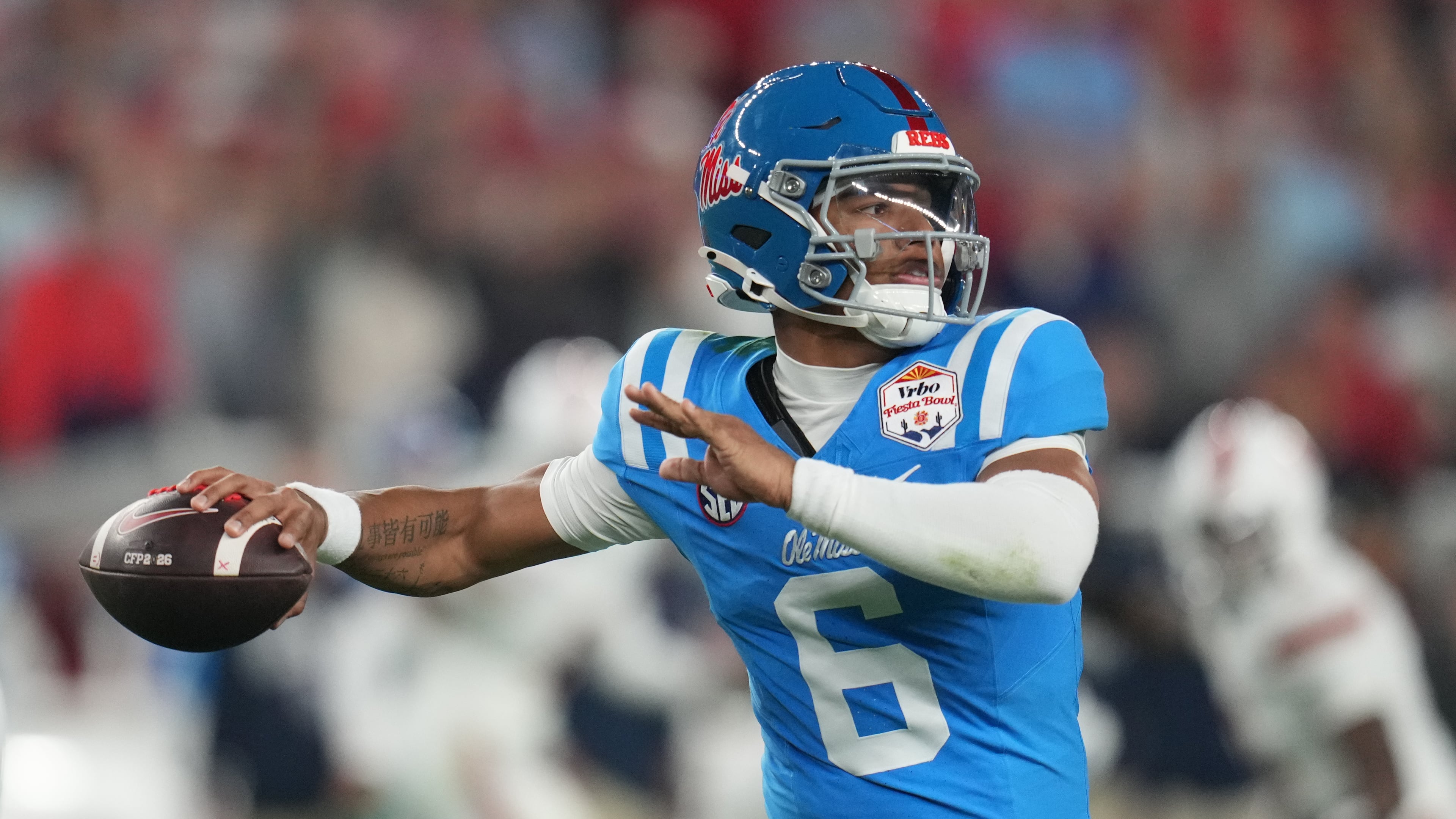 Mississippi quarterback Trinidad Chambliss throws during the first half of the Fiesta Bowl NCAA college football playoff semifinal game against Miami, Thursday, Jan. 8, 2026, in Glendale, Ariz. (AP Photo/Rick Scuteri)