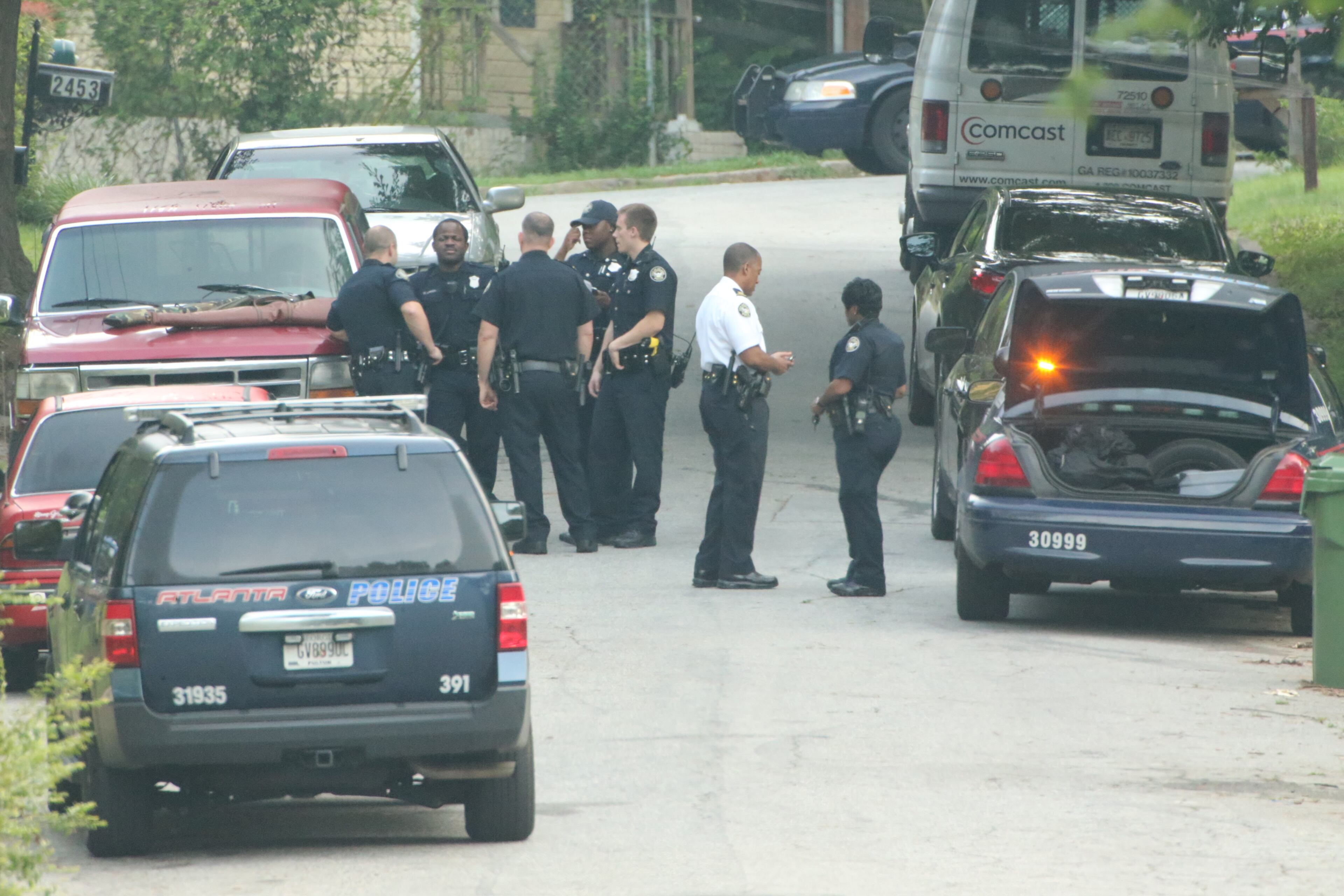 Atlanta police surrounded a home in southwest Atlanta for several hours early today, but when SWAT officers went into the house, the person whey were looking for was not there. JOHN SPINK/JOHNSPINK@AJC.COM