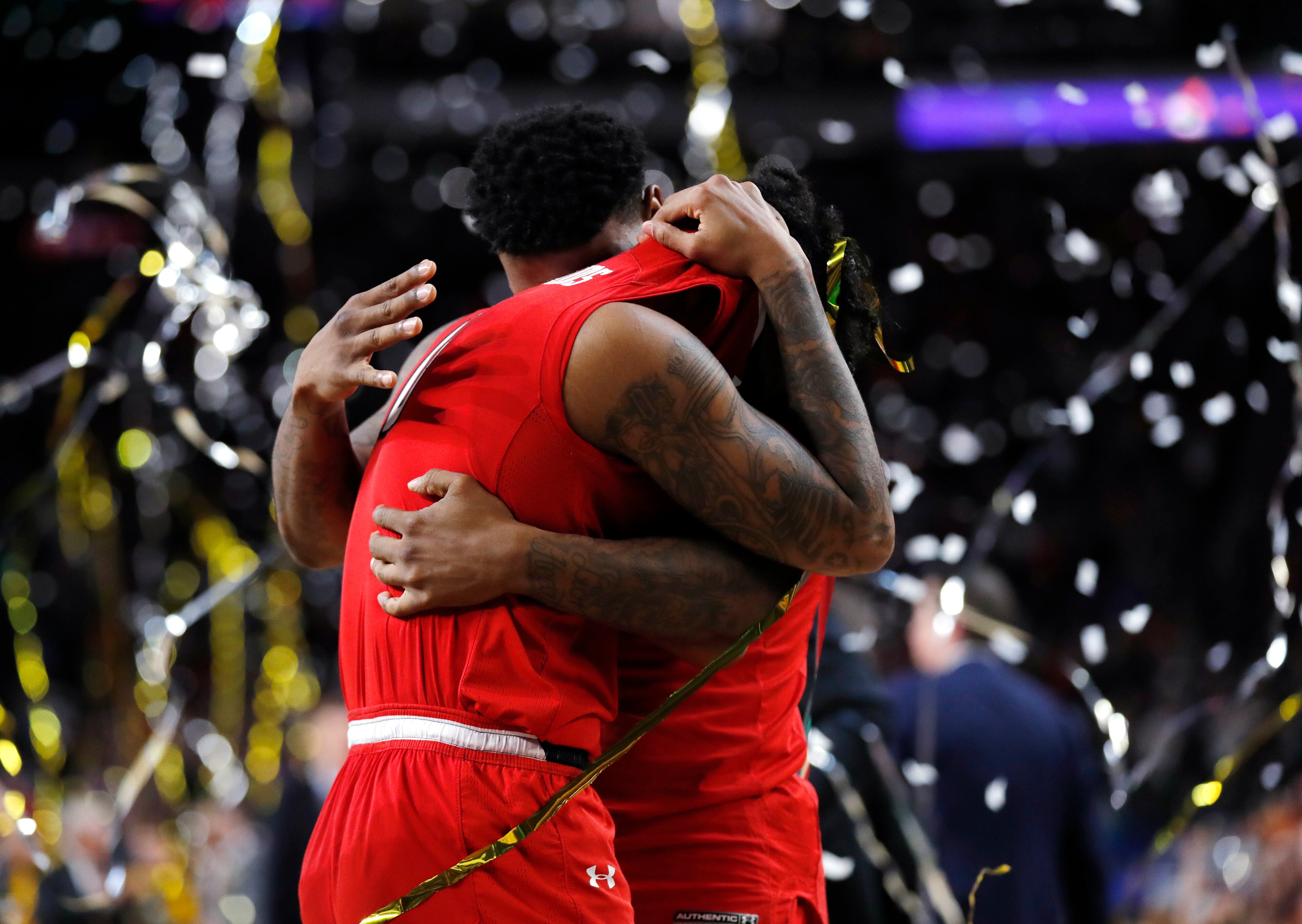 Texas Tech guard Kyler Edwards, left, reacts with teammate Deshawn Corprew at the end of the championship game against Virginia in the Final Four NCAA college basketball tournament, Monday, April 8, 2019, in Minneapolis. Virginia won 85-77 in overtime.(AP Photo/Charlie Neibergall)