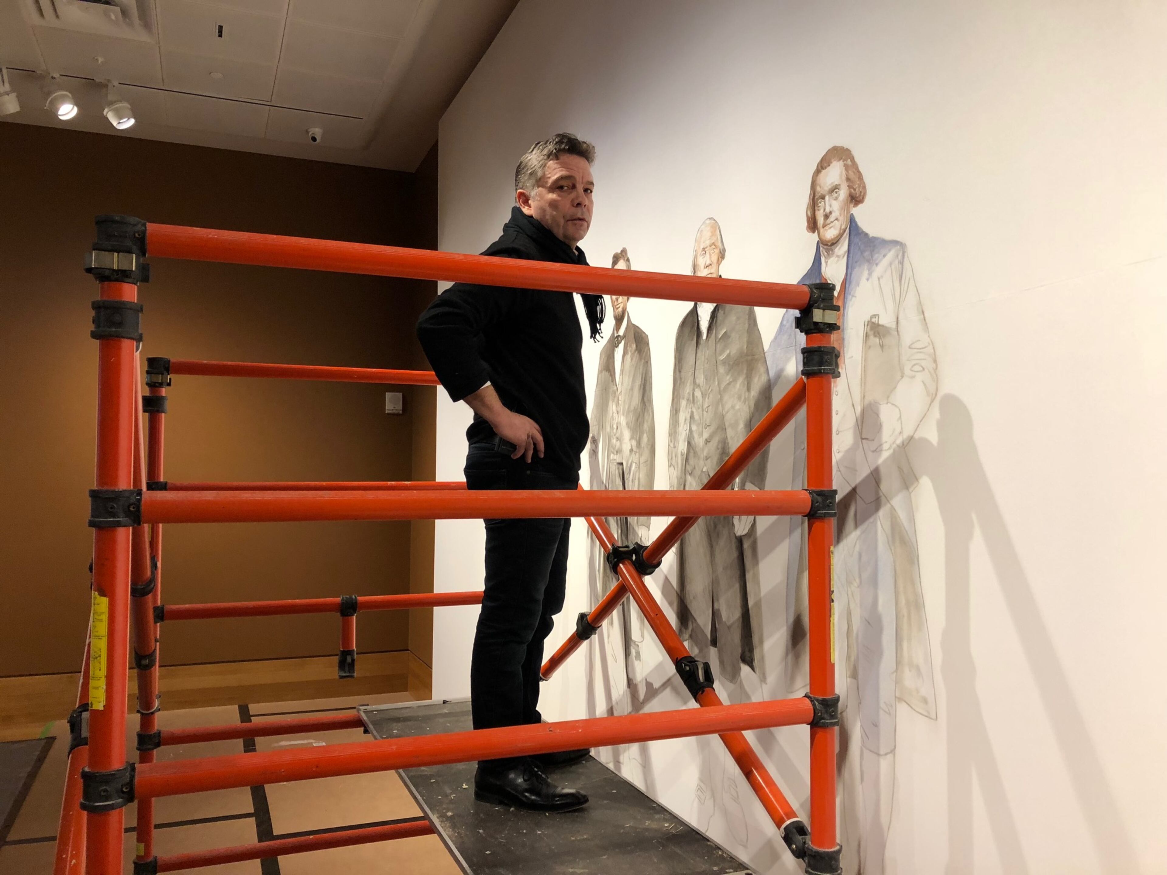 Artist Ross Rossin at work. Rossin is known for his vivid portraits. CONTRIBUTED