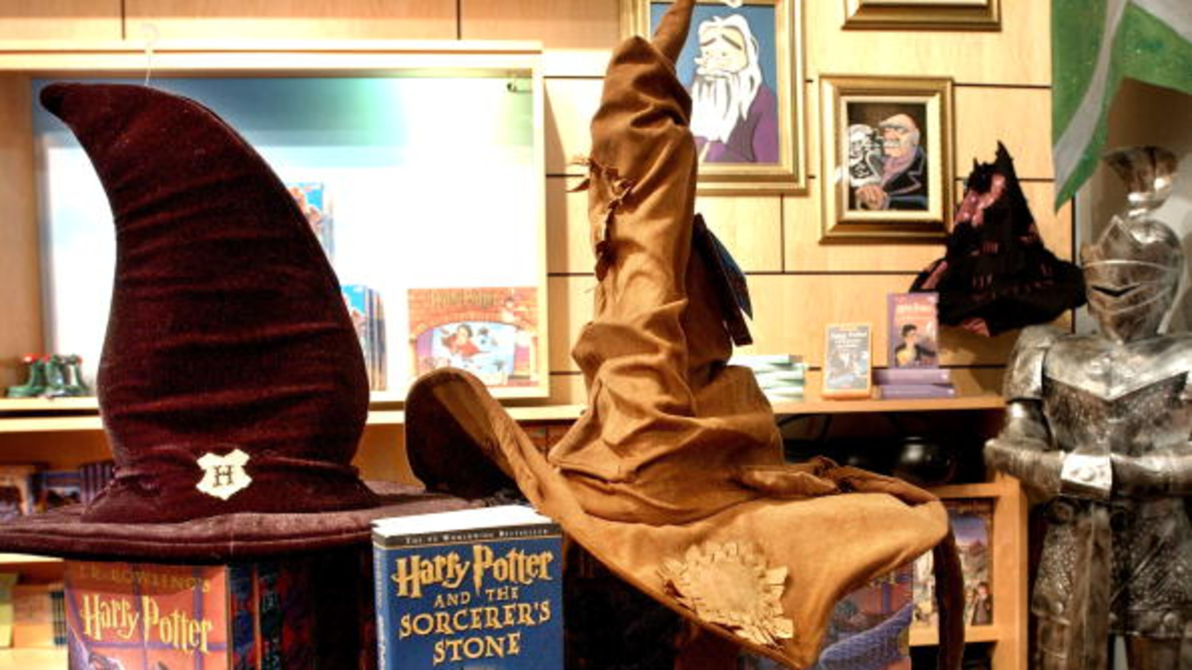 NEW YORK - JUNE 17: Hogwarts Wizard School Sorting hats rest on a display of already released books from the Potter series at the Scholastic store June 17, 2003 in New York, NY. Author J.K. Rowling's highly anticipated latest edition of the Potter series "Harry Potter and the Order of the Phoenix" will be released globally at midnight on June 21. (Photo by Stephen Chernin/Getty Images)