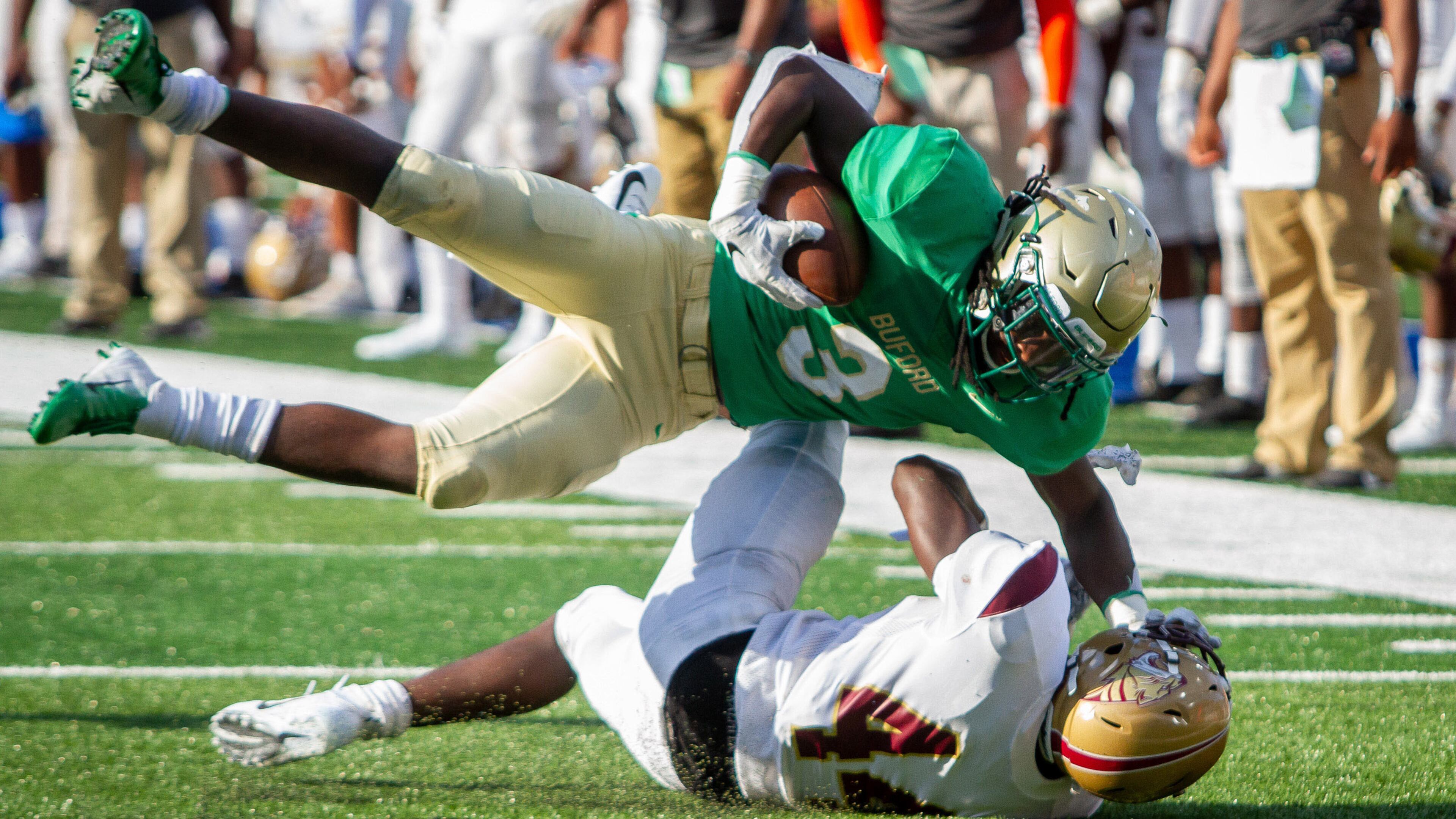 Buford's Derrian Brown is tackled by Tucker's Lucius Chitty during the 2018 Corky Kell Classic Friday, Aug.17, 2018, at Georgia State Stadium in Atlanta.