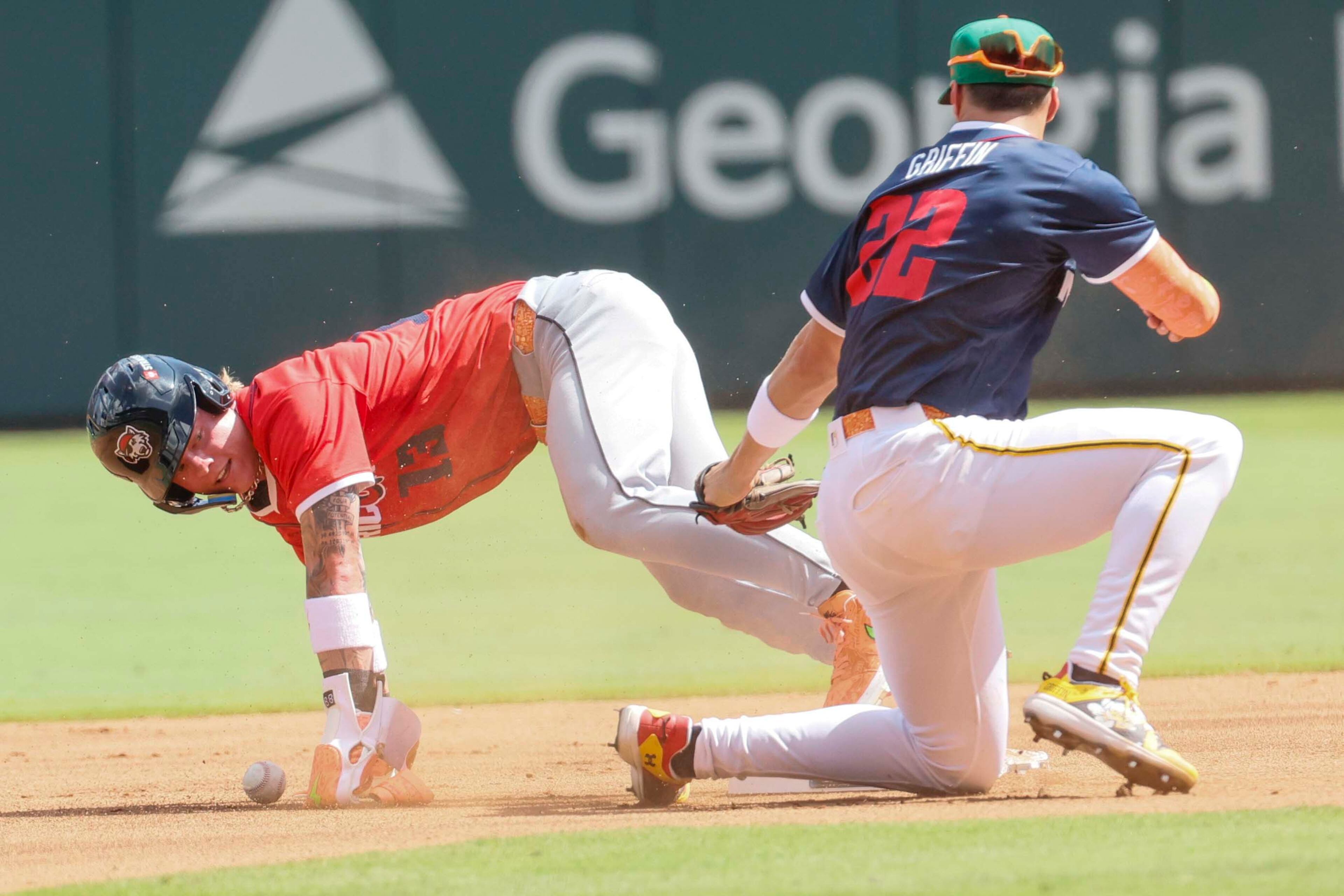 National League pitcher Konnor Griffin (22) tags out American League outfielder Max Clark (13) of the Detroit Tigers during the MLB All-Star Futures Game at Truist Park on Saturday, July 12, 2025, in Atlanta.
(Miguel Martinez/ AJC)