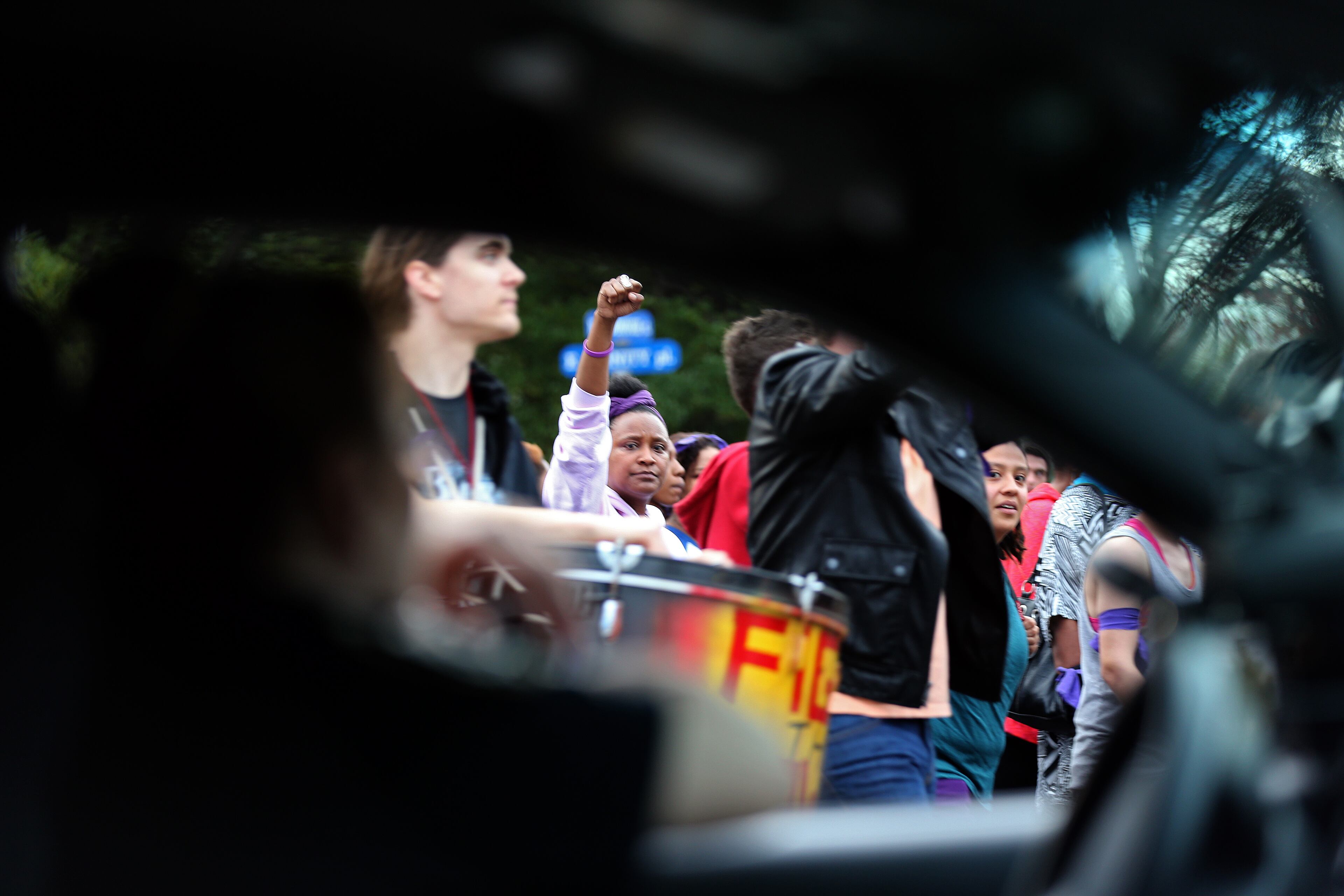 March 11, 2015 Decatur: A Decatur police officer sits in her car while blocking traffic for protesters as they march through downtown Decatur on Wednesday evening March 12, 2015 to protest the shooting death of Anthony Hill. BEN GRAY / BGRAY@AJC.COM