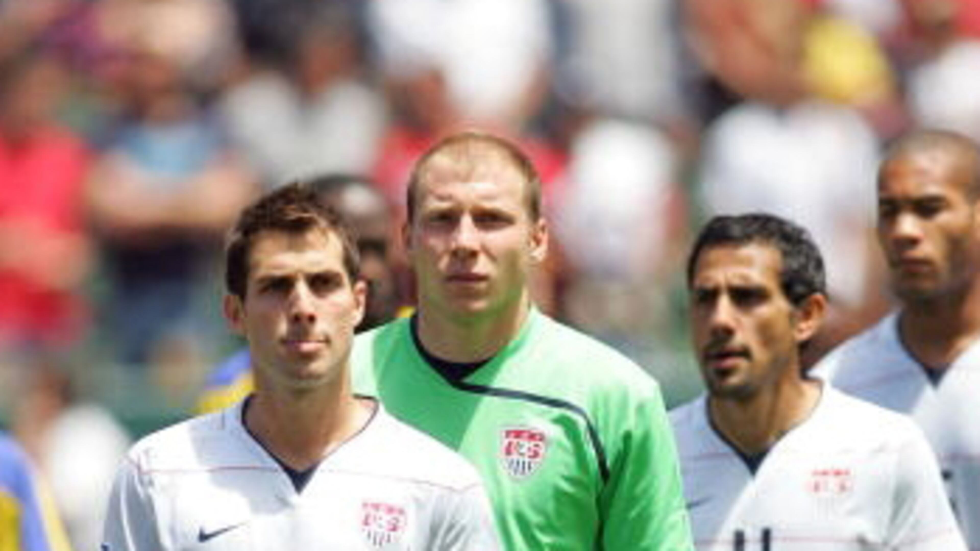 The friendship between Carlos Bocanegra (front) and Brad Guzan (in green) goes back to their days as teammates on the U.S. national team. (Getty)