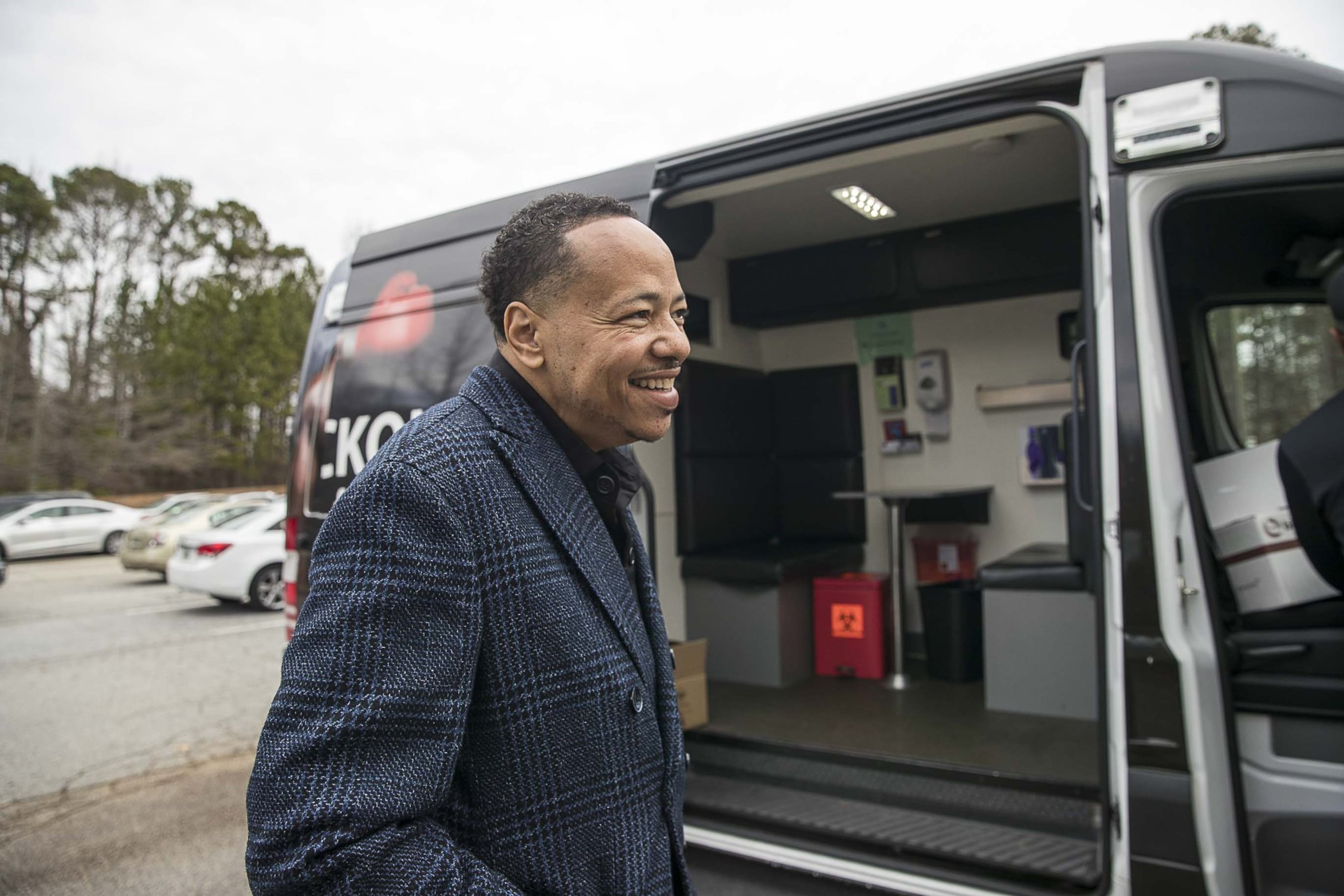 Bible Way Ministries Pastor Monte Norwood prepares to get an HIV/AIDS test administered inside an Aids Healthcare Foundation mobile testing bus at Bible Gateway Ministries in Atlanta’s Norwood Manor neighborhood, Wednesday, December 11, 2019. Pastor Norwood has been tested in front of his congregation to show the importance of knowing your status.