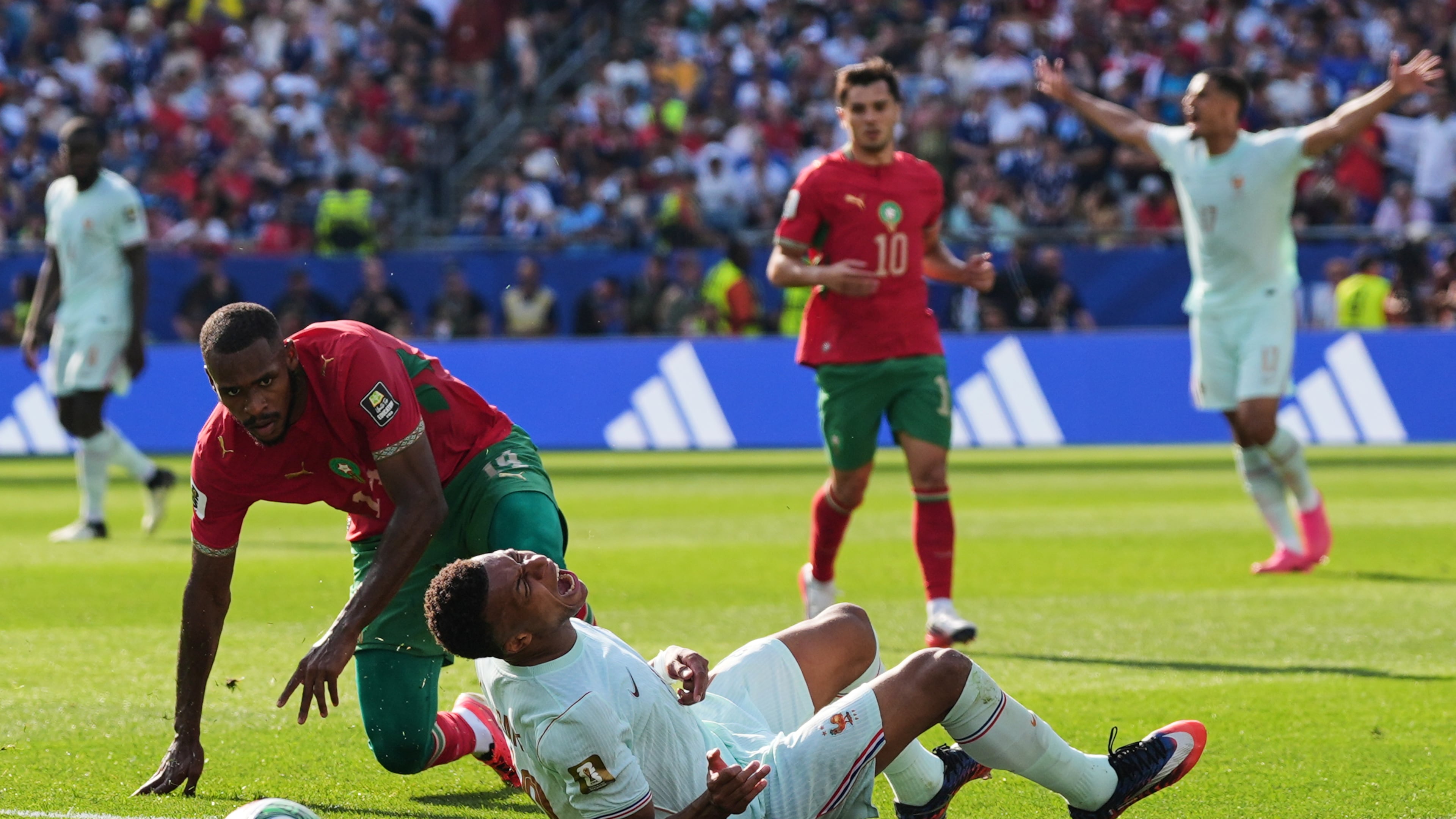 France's Kylian Mbappe (10) reacts to being tripped by Morocco's Issa Diop, left, during the World Cup quarterfinal soccer match between France and Morocco in Foxborough, Mass., near Boston, Thursday, July 9, 2026. (AP Photo/Stephanie Scarbrough)