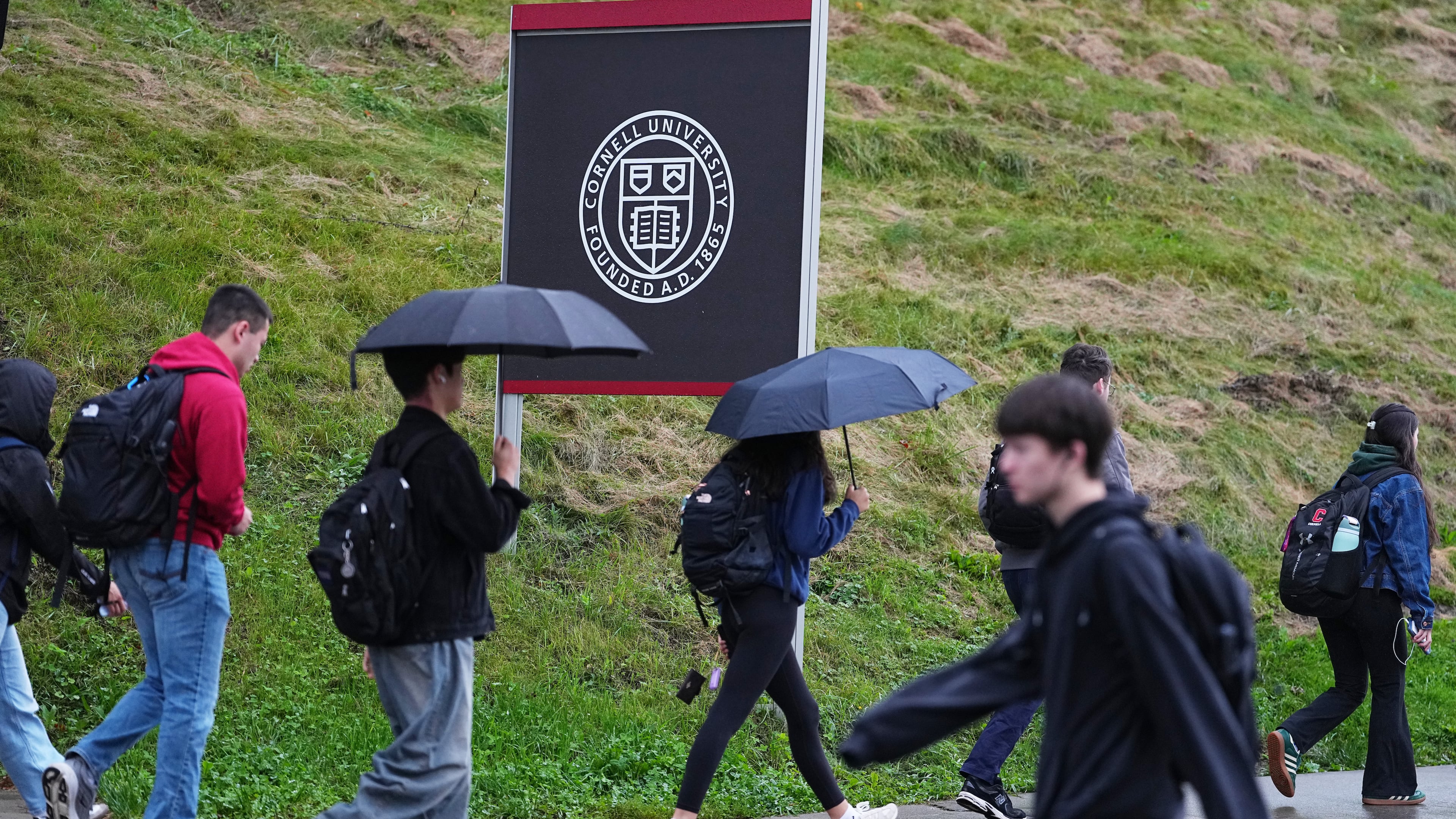 Students walk across the campus of Cornell University in Ithaca, N.Y., Thursday, Oct. 1, 2026. (AP Photo/Matt Rourke)