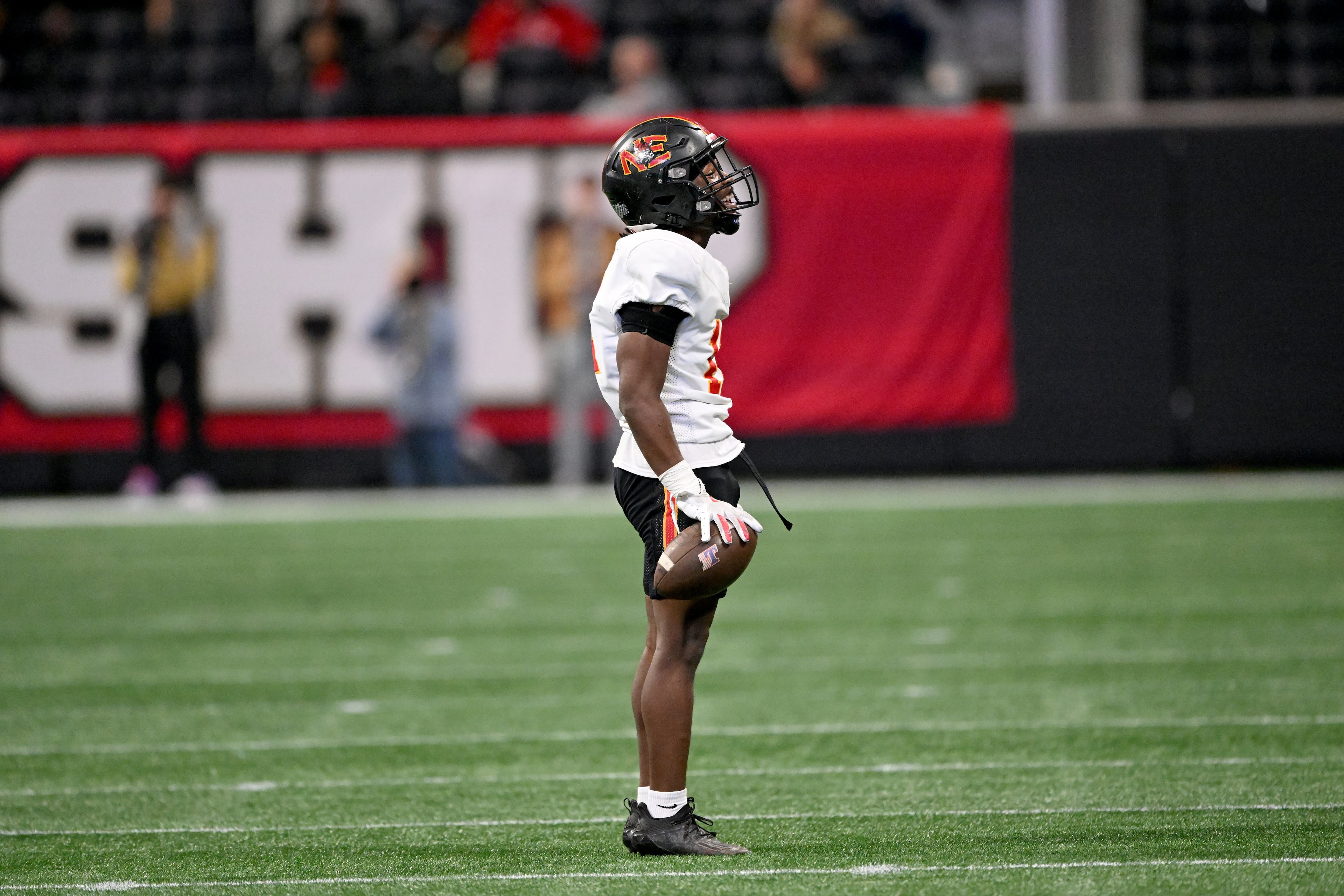 Northeast Macon’s linebacker Elijah Jordan (12) reacts after recovering a fumble during the second half in GHSA Class A-Division State Championship game at Mercedes-Benz Stadium, Tuesday, December 17, 2024, in Atlanta. Toombs County won 38-18 over Northeast Macon. (Hyosub Shin / AJC)