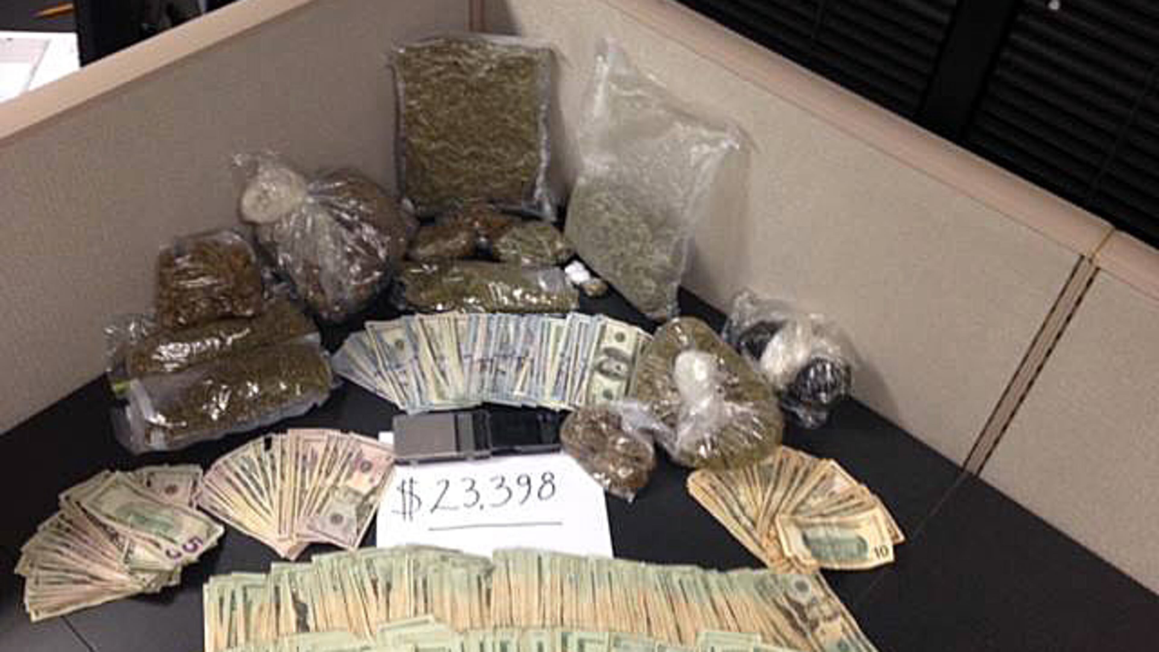 A Rockdale County deputy found 4.6 pounds of marijuana and more than $23,000 inside a vehicle Tuesday night during a traffic stop. (Photo: Rockdale County Sheriff’s Office)