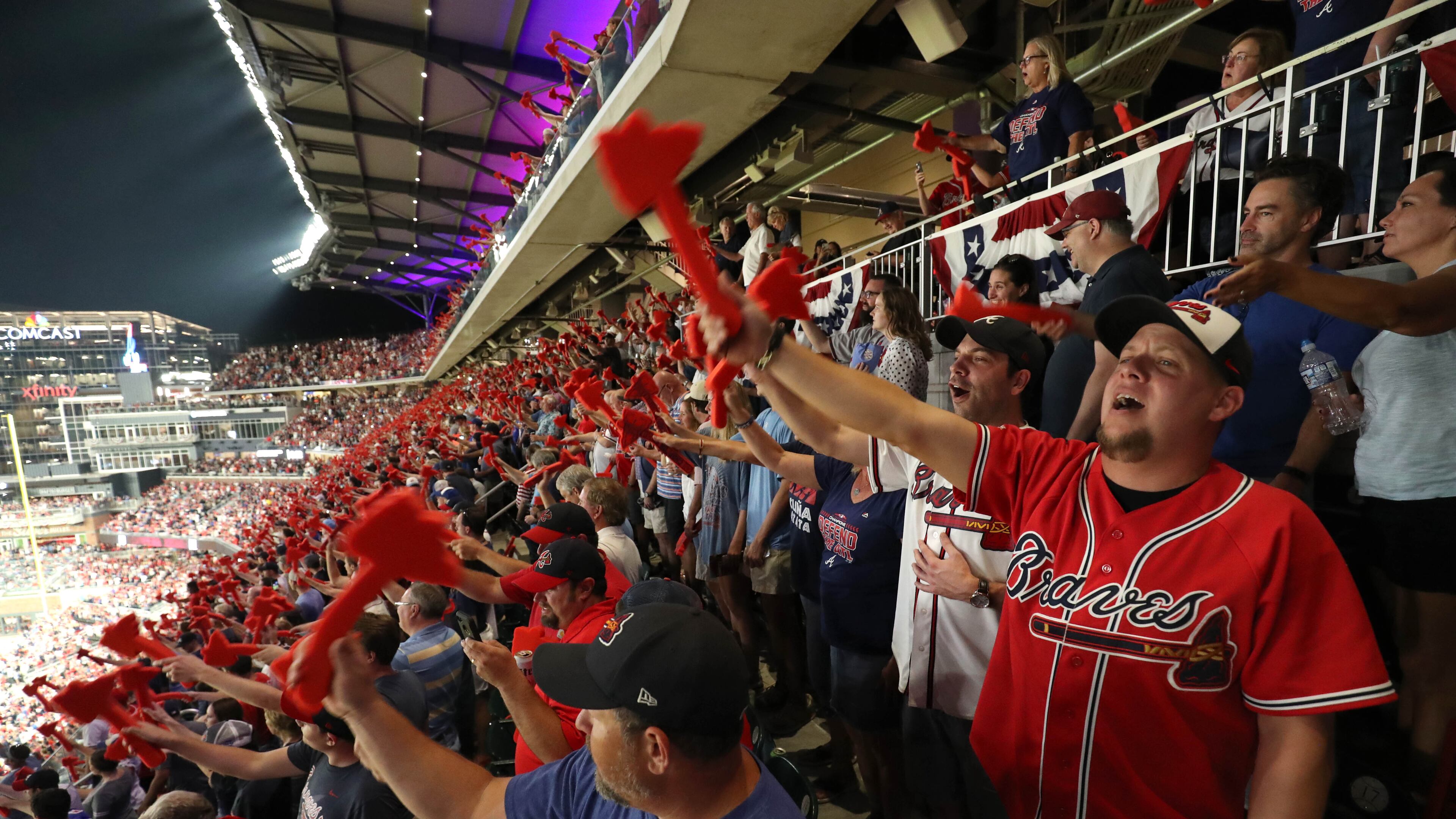 Braves fan Josh Philemon, of Newnan, participates in the tomahawk chop before the start of Game 3 of the National League Division Series on Sunday at SunTrust Park.baseball game