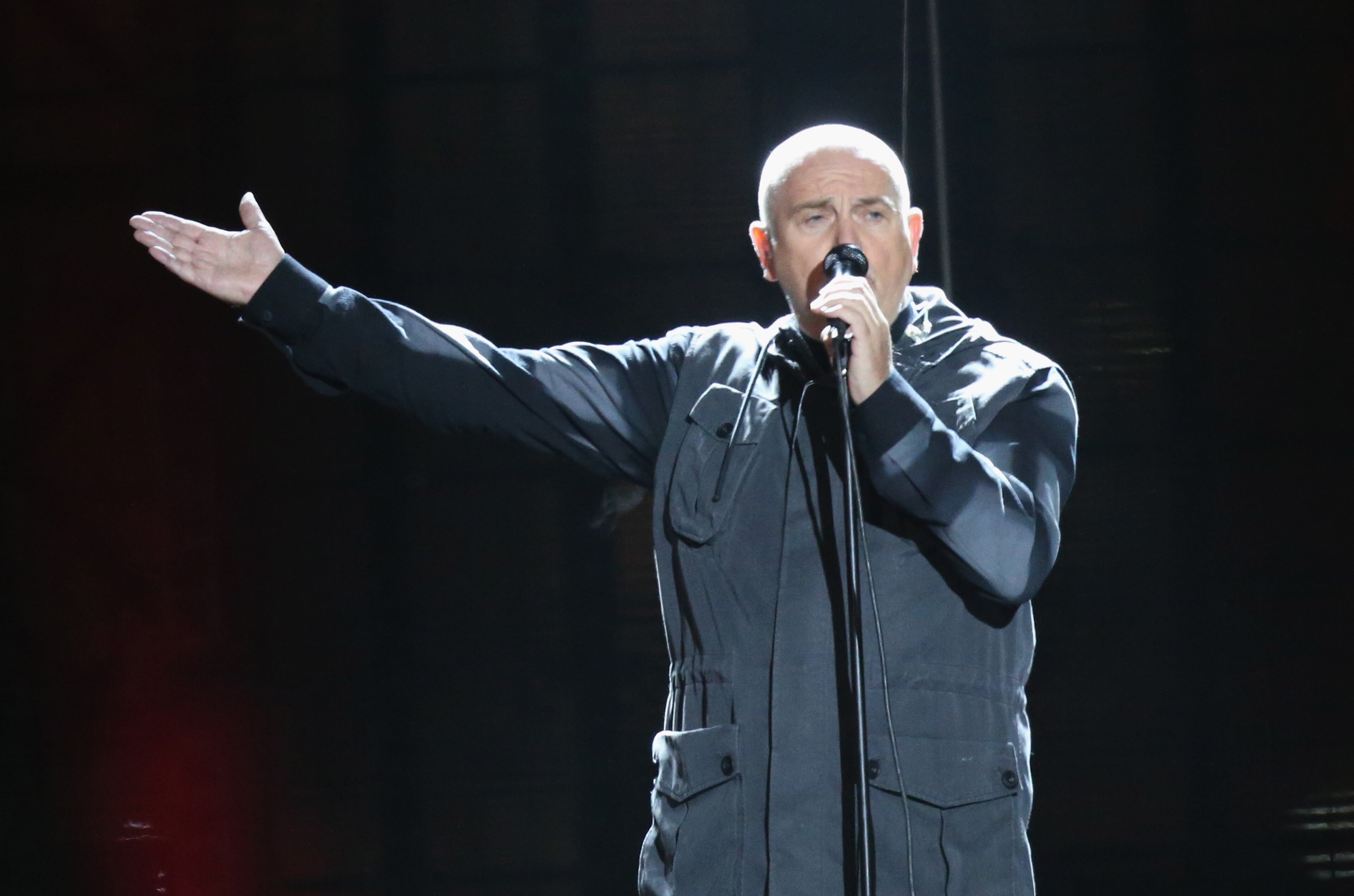 Peter Gabriel performs in front of the Brandenburg Gate during celebrations on the 25th anniversary of the fall of the Berlin Wall on November 9, 2014 in Berlin, Germany. The city of Berlin is commemorating the 25th anniversary of the fall of the Berlin Wall with an installation of 6,800 lamps coupled with illuminated balloons along a 15km route where the Wall once ran and divided the city into capitalist West and communist East. The fall of the Wall on November 9, 1989, was among the most powerful symbols of the revolutions that swept through the communist countries of Eastern Europe and heralded the end of the Cold War. Built by the communist authorities of East Germany in 1961, the Wall prevented East Germans from fleeing west and was equipped with guard towers and deadly traps. (Photo by Sean Gallup/Getty Images)