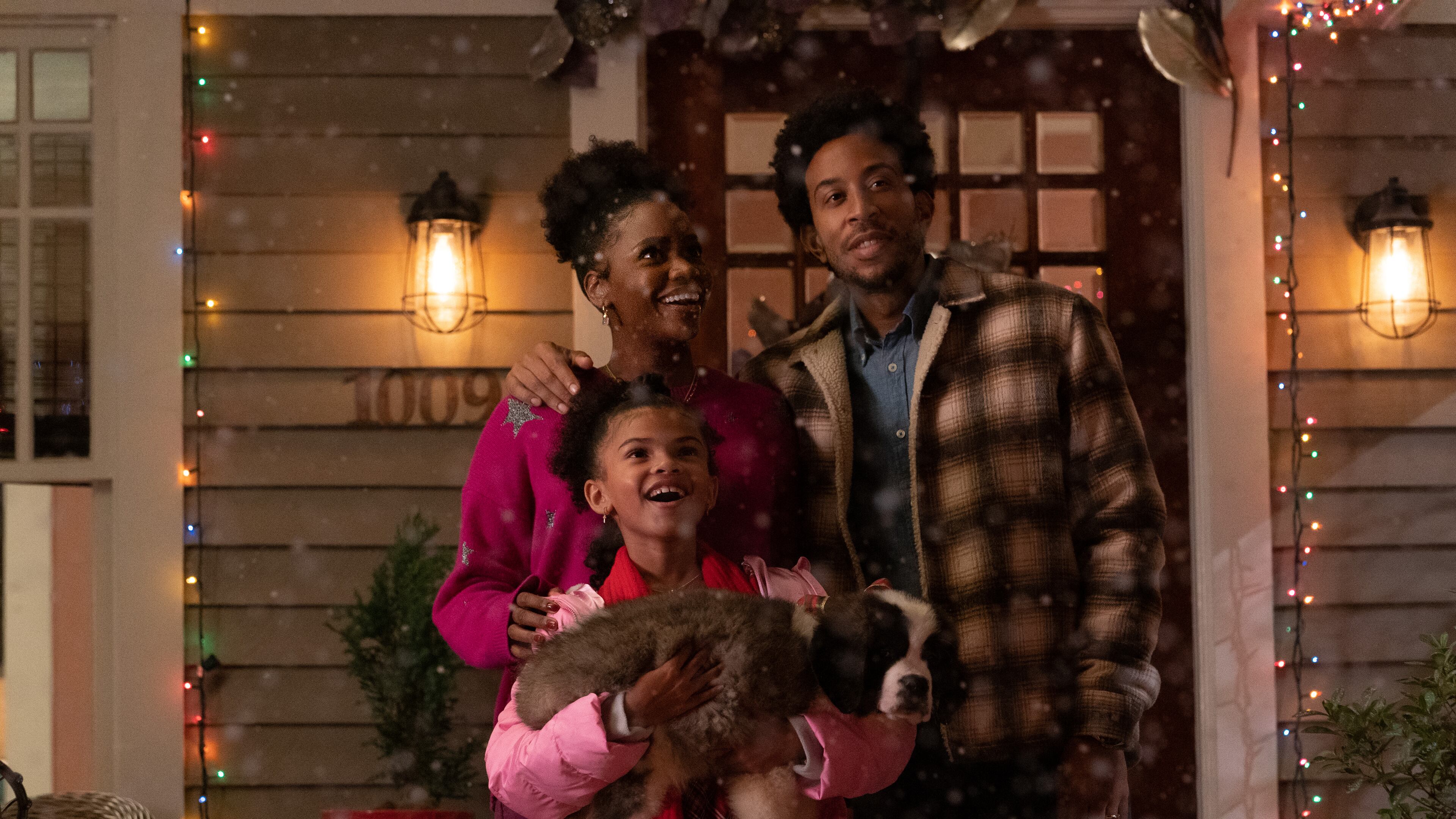 Teyonah Parris as Allison (from left), Madison Skye Validum as Charlotte, and Chris 'Ludacris' Bridges as Eddie in "Dashing Through the Snow" on Disney+. Photo by Steve Dietl. © 2023 Disney Enterprises, In.c All Rights Reserved.