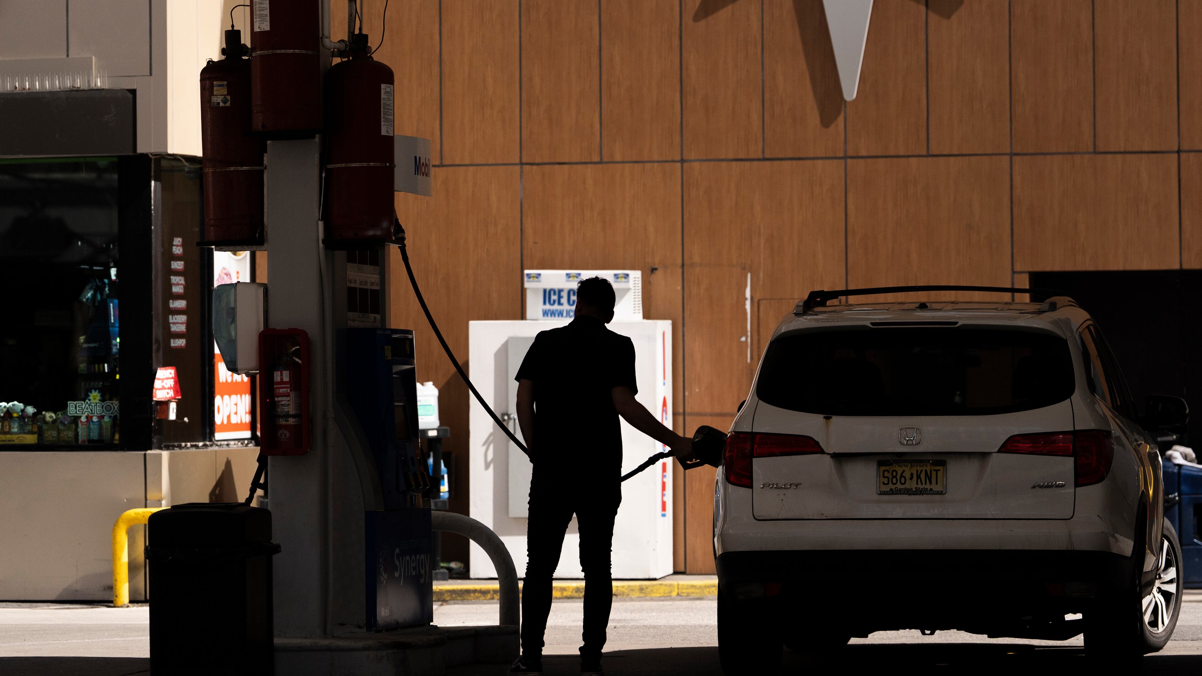 FILE - A person gets gas at a station March 10, 2026, in New York. (AP Photo/Yuki Iwamura, File)
