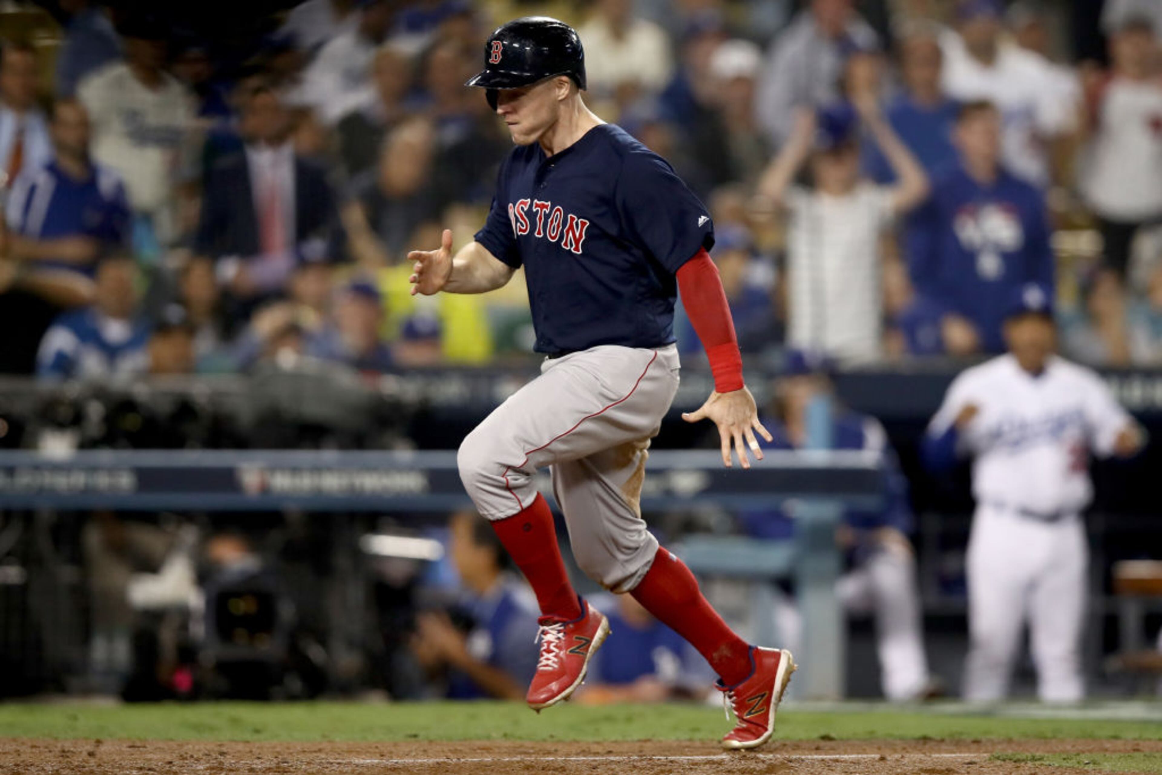 LOS ANGELES, CA - OCTOBER 26: Brock Holt #12 of the Boston Red Sox celebrates as he scores a thirteenth inning run against the Los Angeles Dodgers in Game Three of the 2018 World Series at Dodger Stadium on October 26, 2018 in Los Angeles, California. (Photo by Ezra Shaw/Getty Images)
