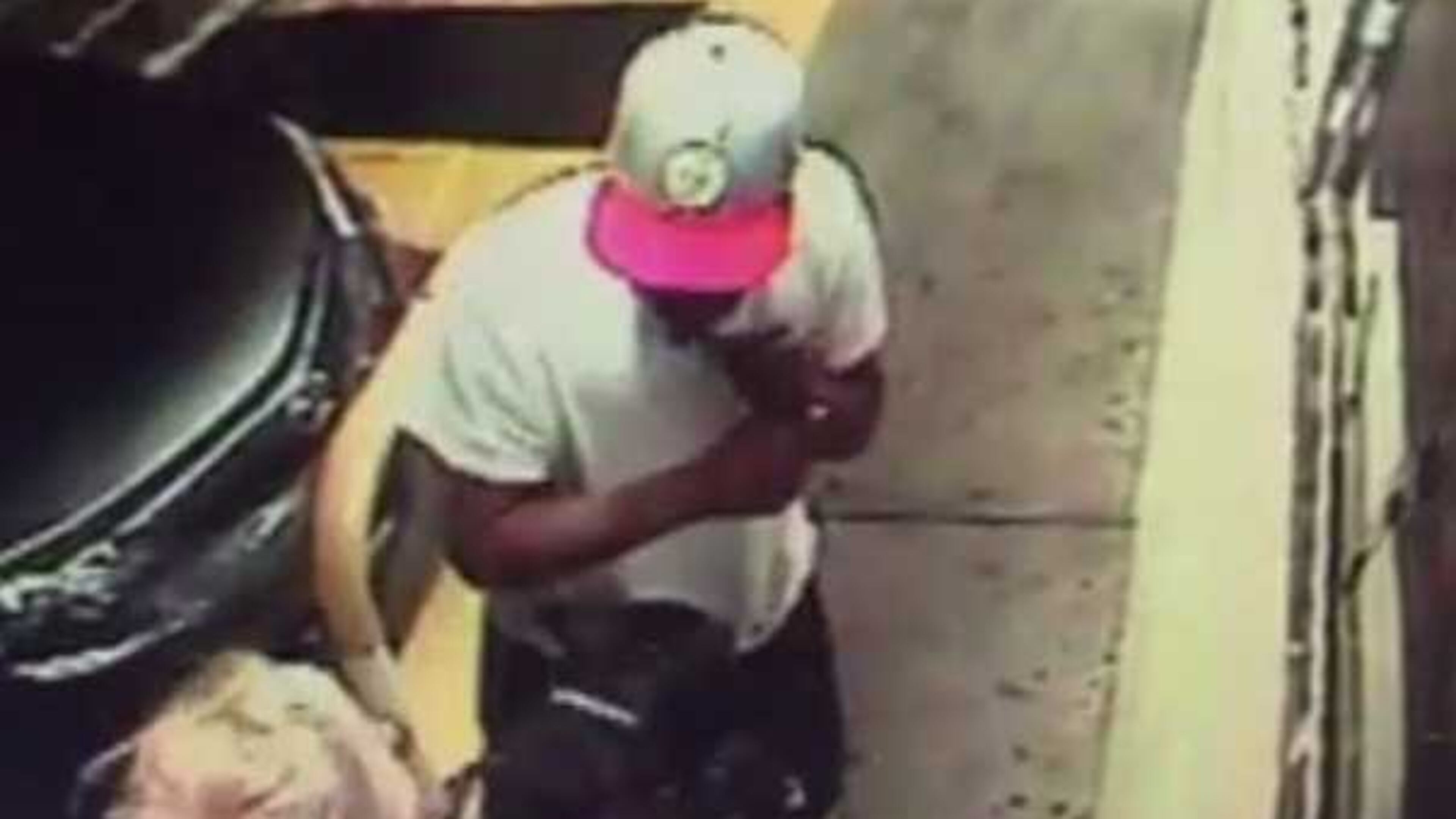 DeKalb County police have made an arrest after a man was seen punching a puppy in the face on video outside a gas station.