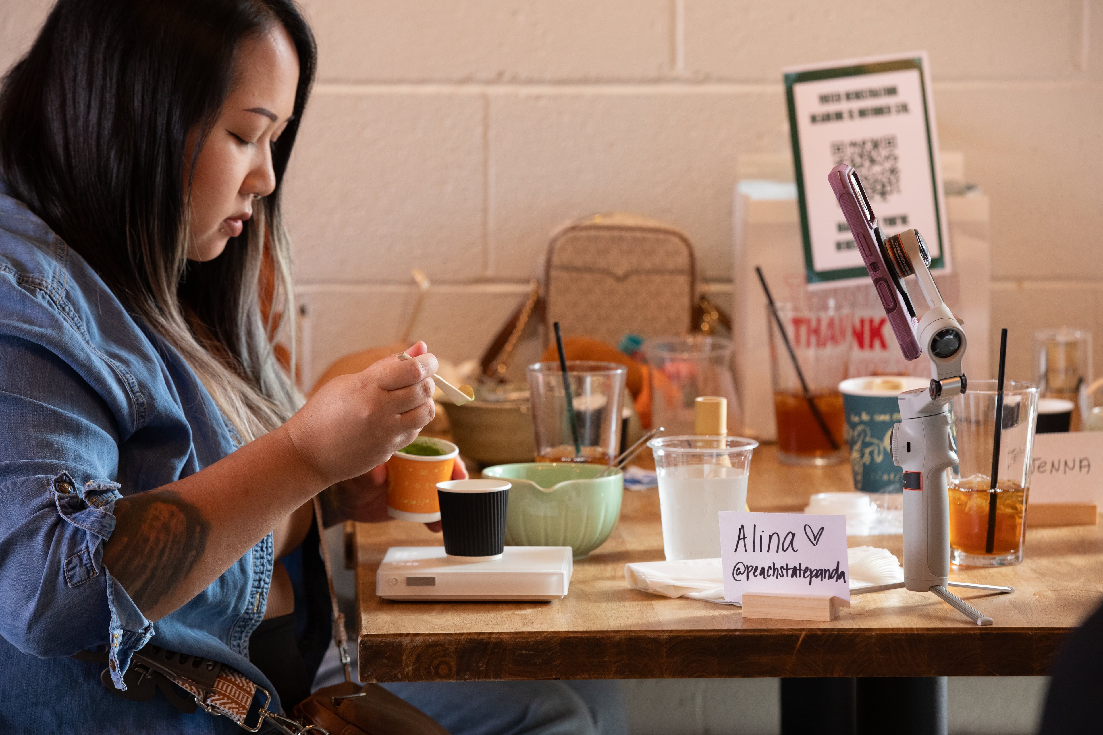 Content creators make matcha at a voter mobilization event hosted by the AAPI Victory Fund at Hopstix Brewery in Chamblee on Oct. 2, 2026. (Riley Bunch/AJC)
