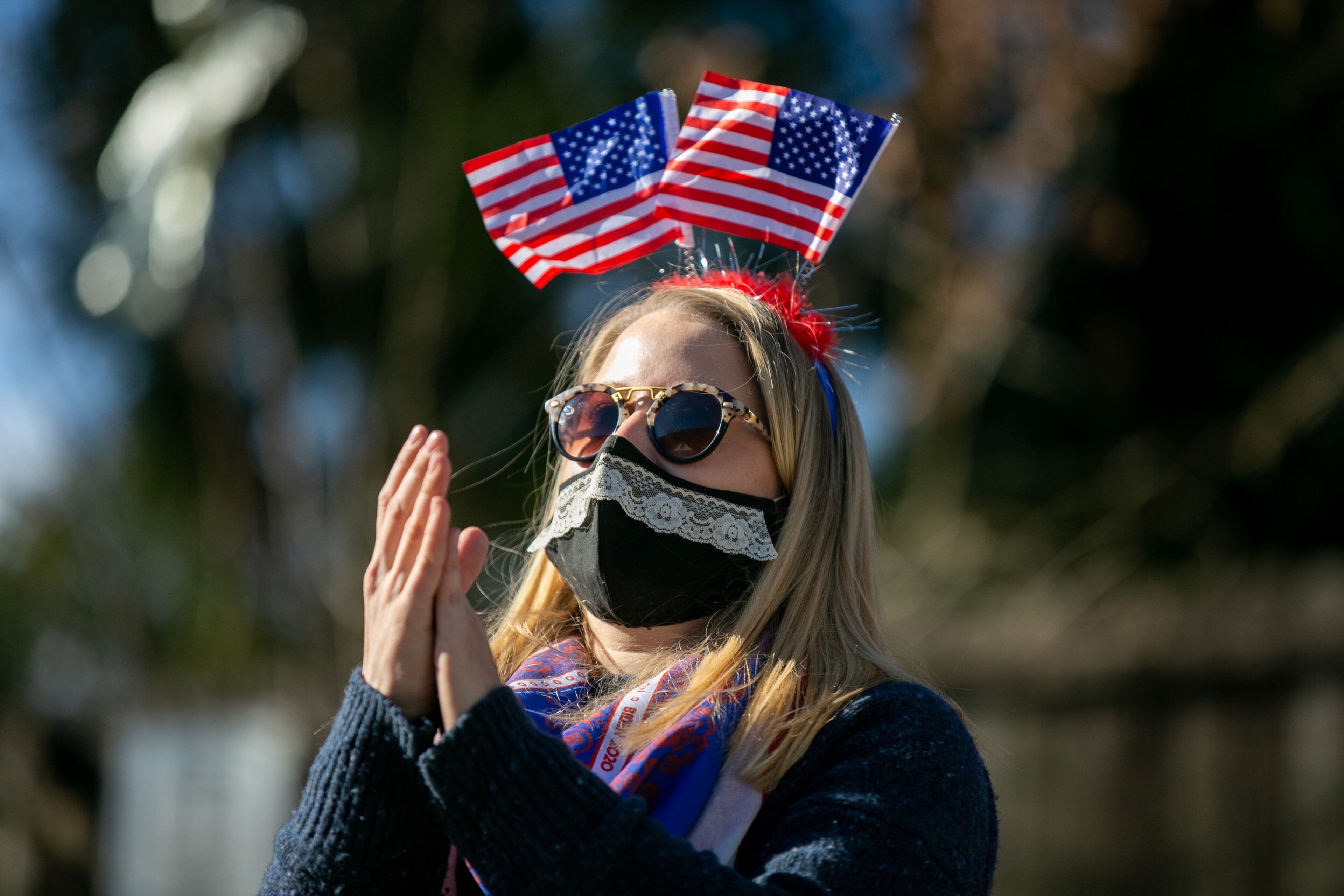 Abby Larimer claps during an Inauguration watch party in Atlanta, Georgia, on Wednesday, January 20, 2021. Manuel’s Tavern held an Inauguration watch party on Wednesday to celebrate the election of President Joe Biden. (Rebecca Wright for the Atlanta Journal-Constitution)