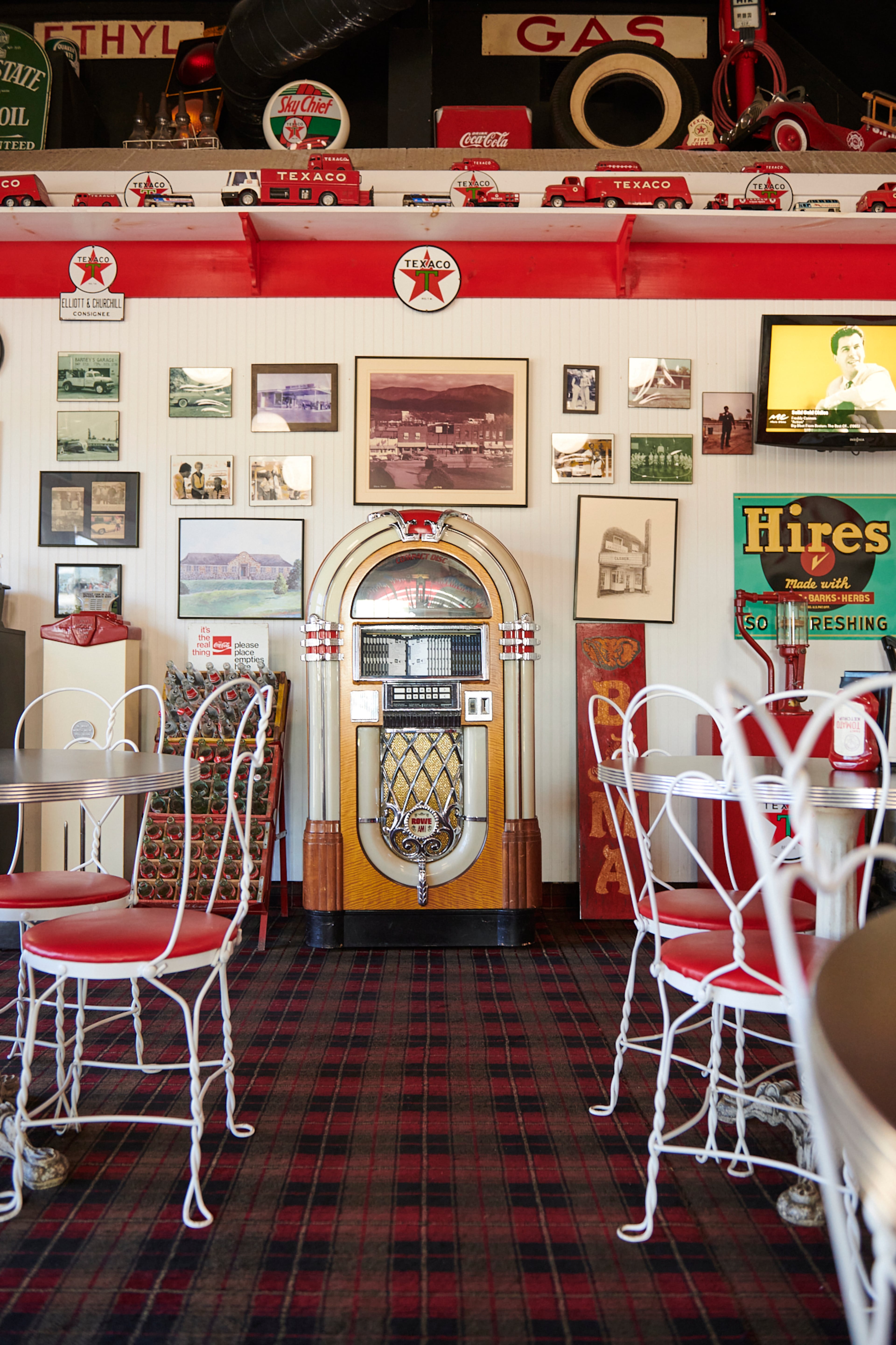 A jukebox and family memorabilia are part of the decor in the dining room at the Creme Hut in Chatsworth. (Greg Rannells for The Atlanta Journal-Constitution)