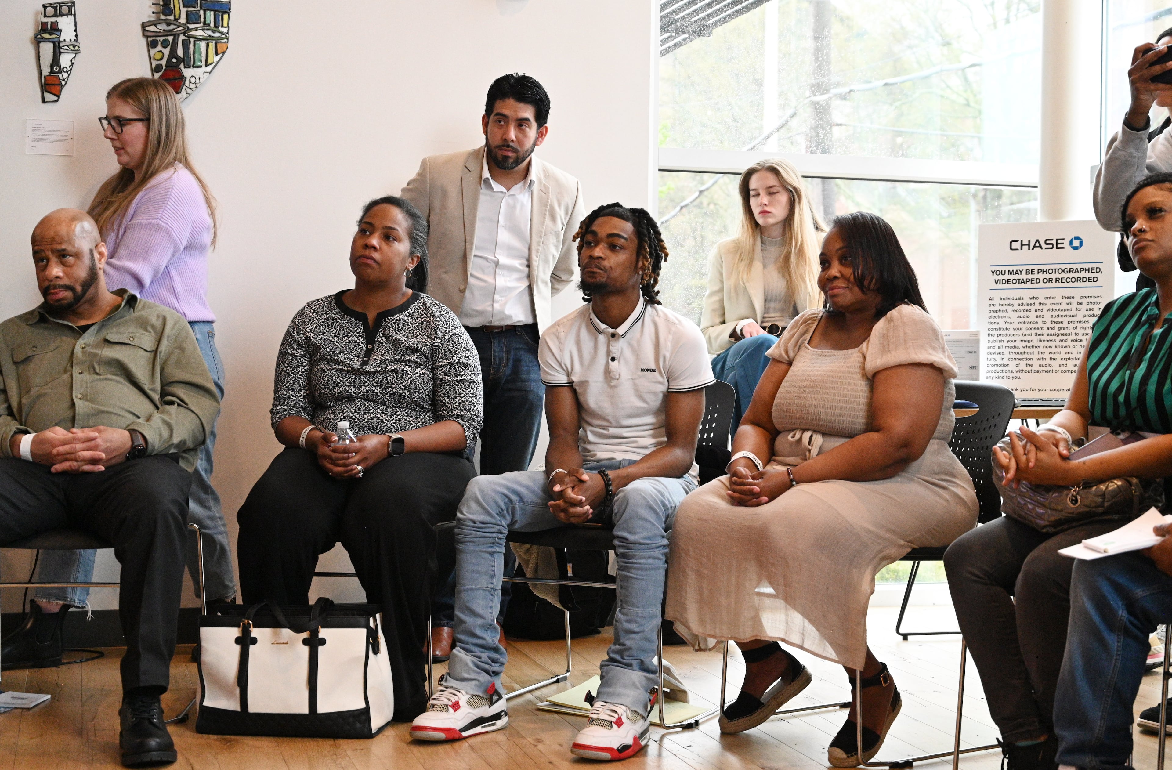 Workshop participants including Kevaughn Hickman (center) and Katrina Butler (right) listen to Atlanta Hawks guard Trent Forrest (not pictured) during educational workshops to enhance their financial health and understanding of business finances at Summerhill Chase Community Center Branch, Tuesday, March 26, 2024, in Atlanta. The Atlanta Hawks and Chase are launching a new community program for aspiring entrepreneurs who have left.the justice system. (Hyosub Shin / Hyosub.Shin@ajc.com)