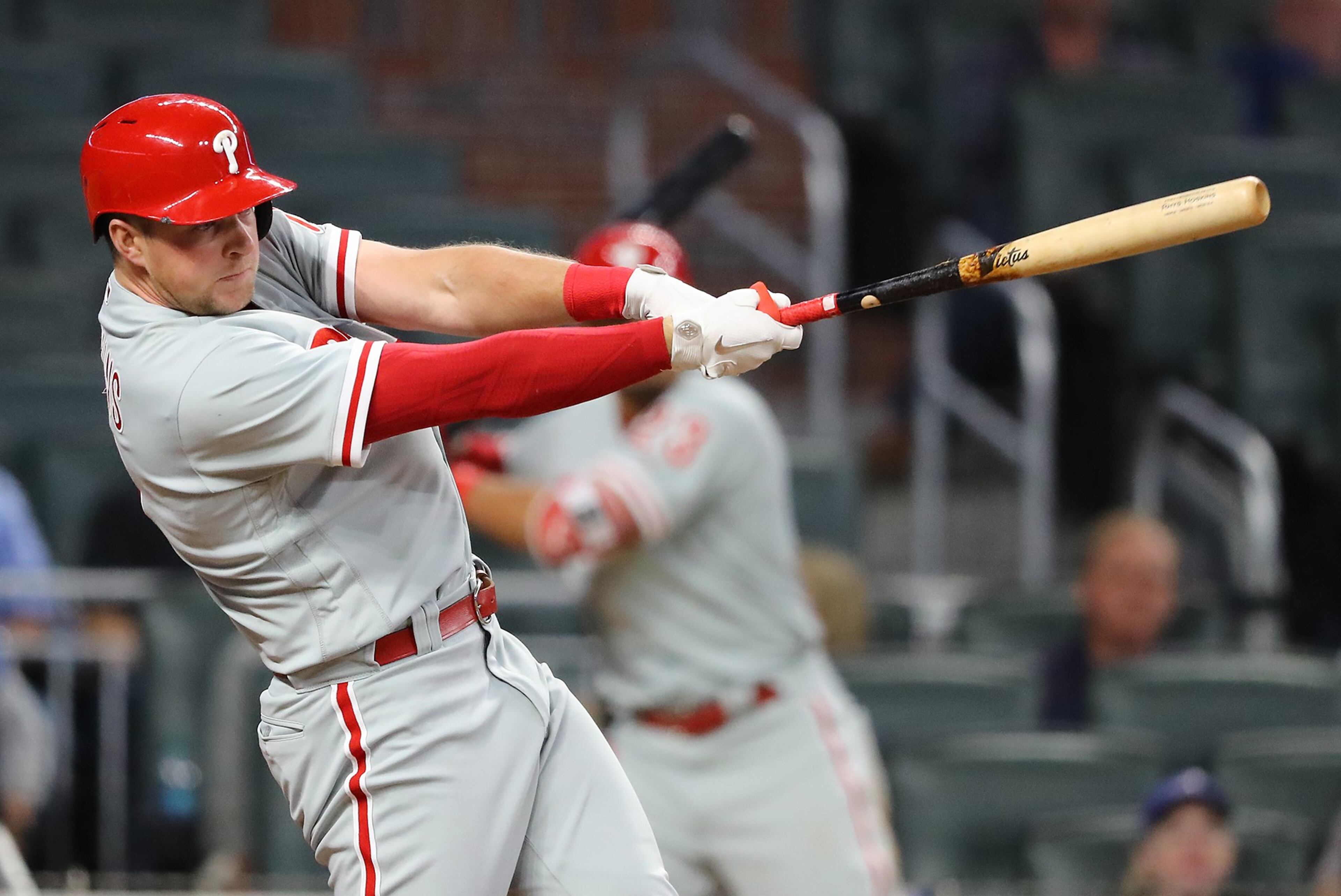 April 17, 2018 Atlanta: Phillies Rhys Hoskins hits a 2-RBI double to take a 3-1 lead over the Braves during the 10th inning in a MLB baseball game on Tuesday, April 17, 2018, in Atlanta. The Phillies scored four runs in the inning to beat the Braves 5-1. Curtis Compton/ccompton@ajc.com