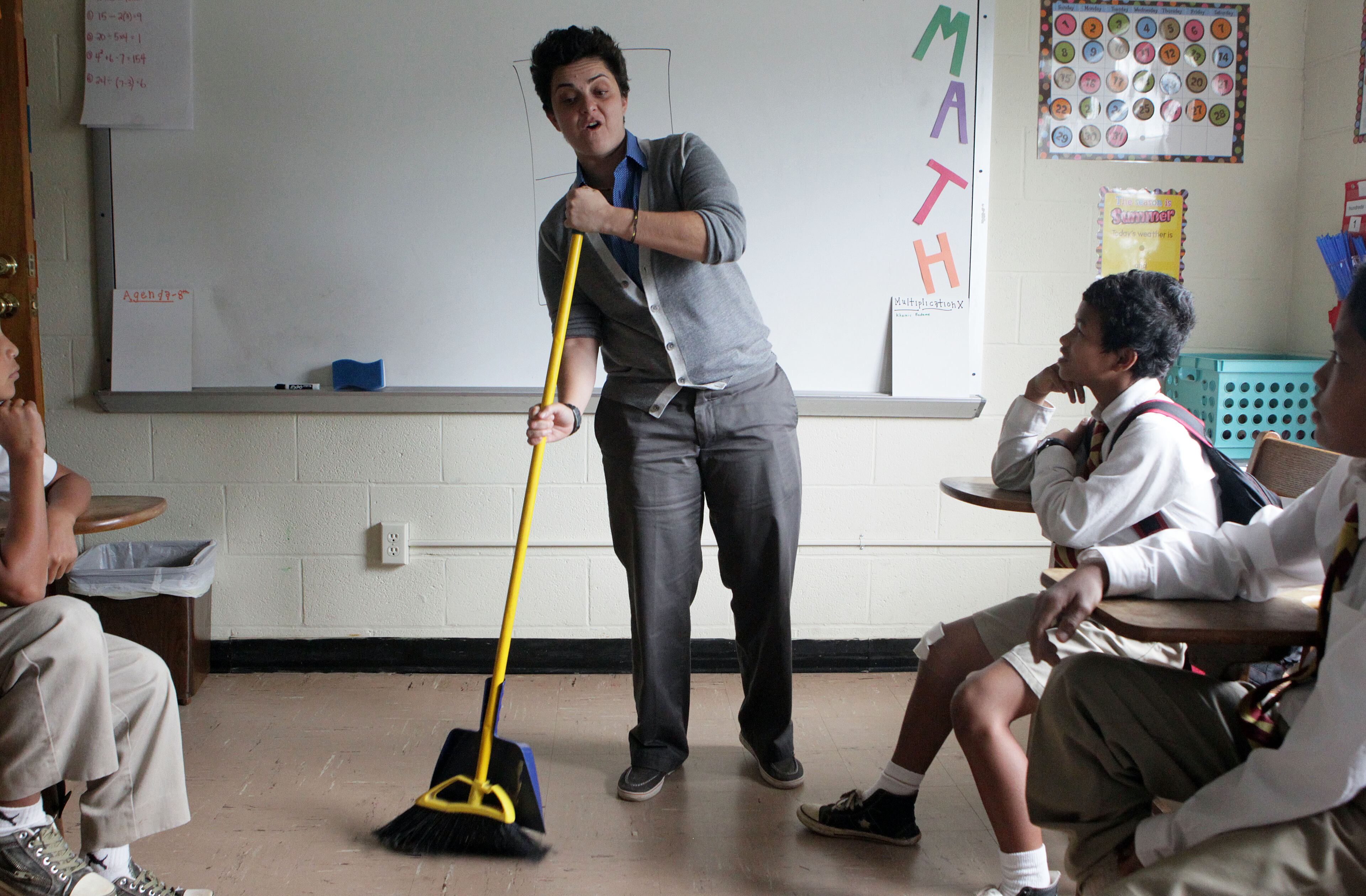 Luma uses a broom to illustrate the "sweeper" position in soccer. She has two requirements for enrolling in the tuition-free Fugees Academy: Children must be refugees and their families must live below the poverty line. Most come from countries at war.