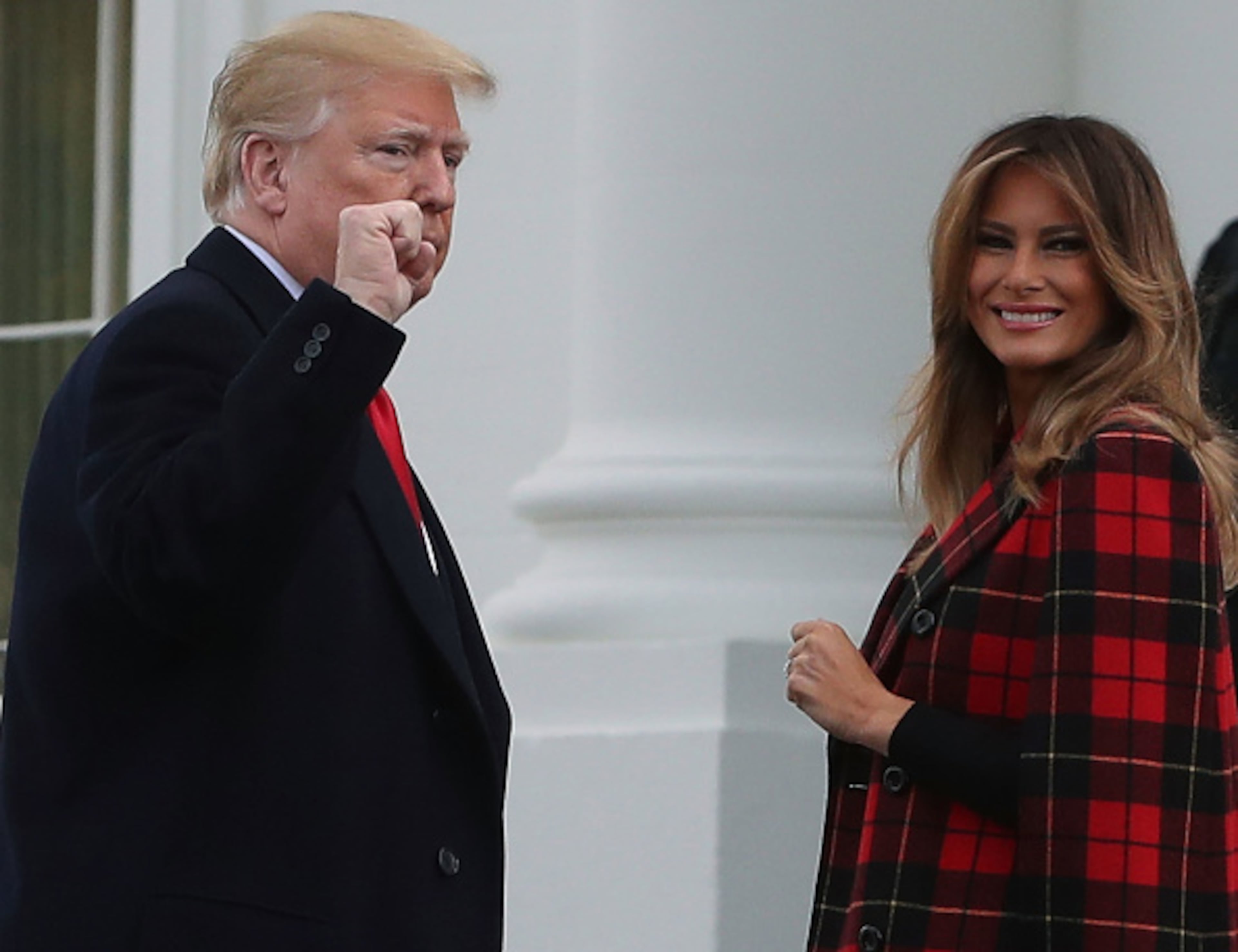 WASHINGTON, DC - NOVEMBER 19: U.S. President Donald Trump gestures as he and first lady Melania Trump welcome a North Carolina grown Fraser Fir Christmas Tree at the North Portico as it makes its way to the Blue Room for display at the White House on November 19, 2018 in Washington, DC. (Photo by Mark Wilson/Getty Images)