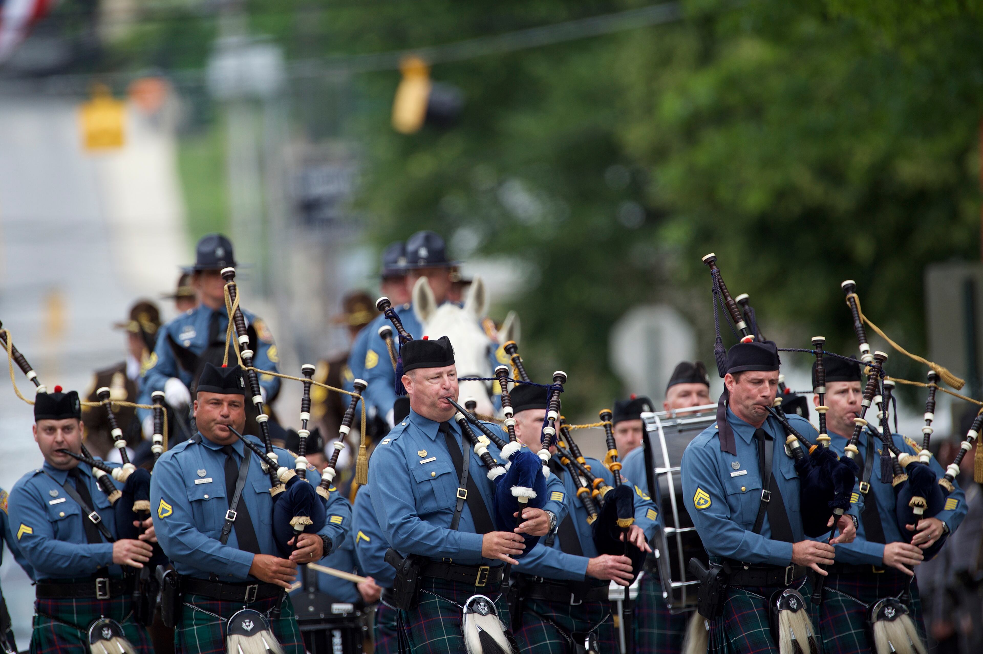 WILMINGTON, DE - JUNE 6: A funeral procession marches towards a mass of Christian burial at St. Anthony of Padua Church for former Delaware Attorney General Beau Biden on June 6, 2015 in Wilmington, Delaware. U.S. President Barack Obama is expected to deliver a eulogy for the son of Vice President Joe Biden after he died at 46 following a two-year battle with brain cancer. (Photo by Mark Makela/Getty Images)