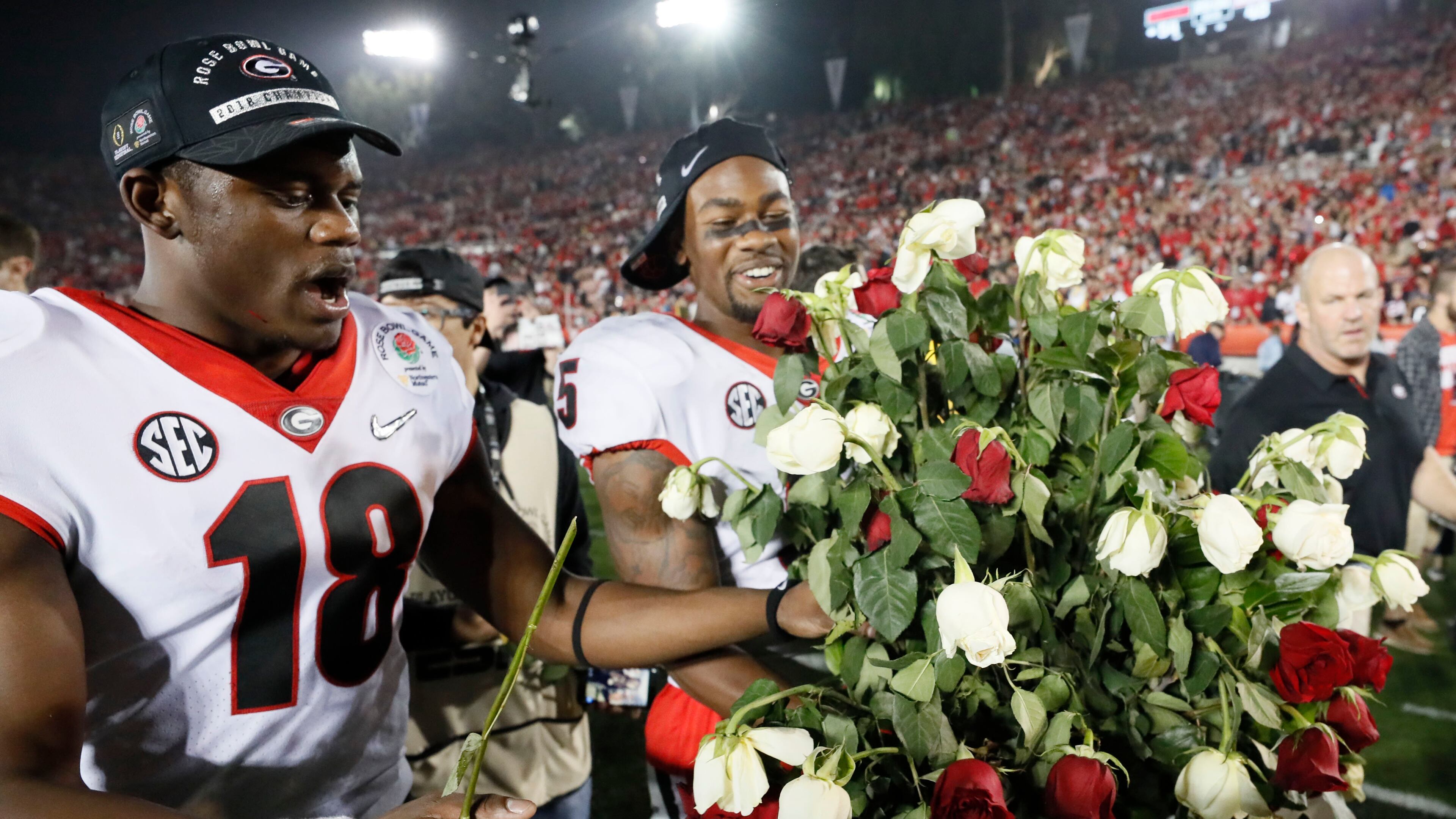 1/1/18 - Pasadena - Georgia Bulldogs defensive back Deandre Baker (18) and Georgia Bulldogs wide receiver Terry Godwin (5) celebrate after Georgia won the College Football Playoff Semifinal at the Rose Bowl Game on Monday, January 1, 2018, in Pasadena. Georgia won 54-48. BOB ANDRES /BANDRES@AJC.COM