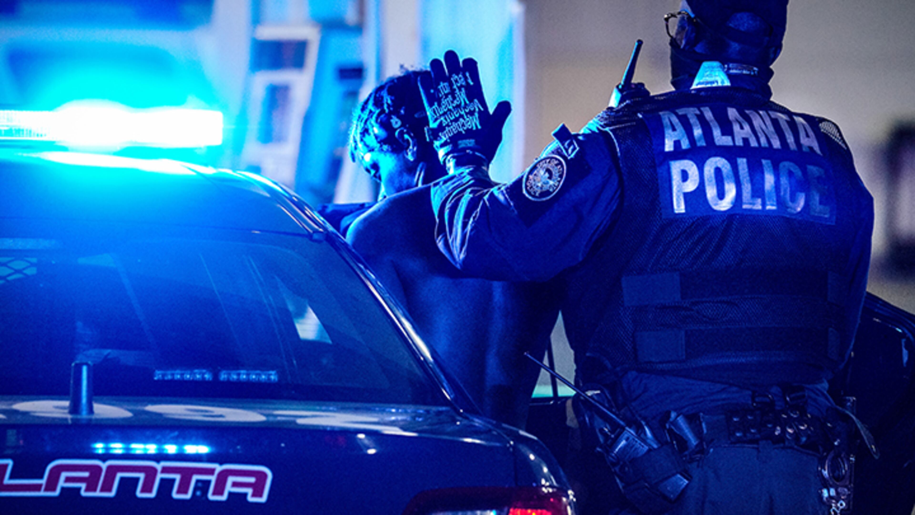 An Atlanta officer arrests a suspect during a weekend crackdown on street racing.