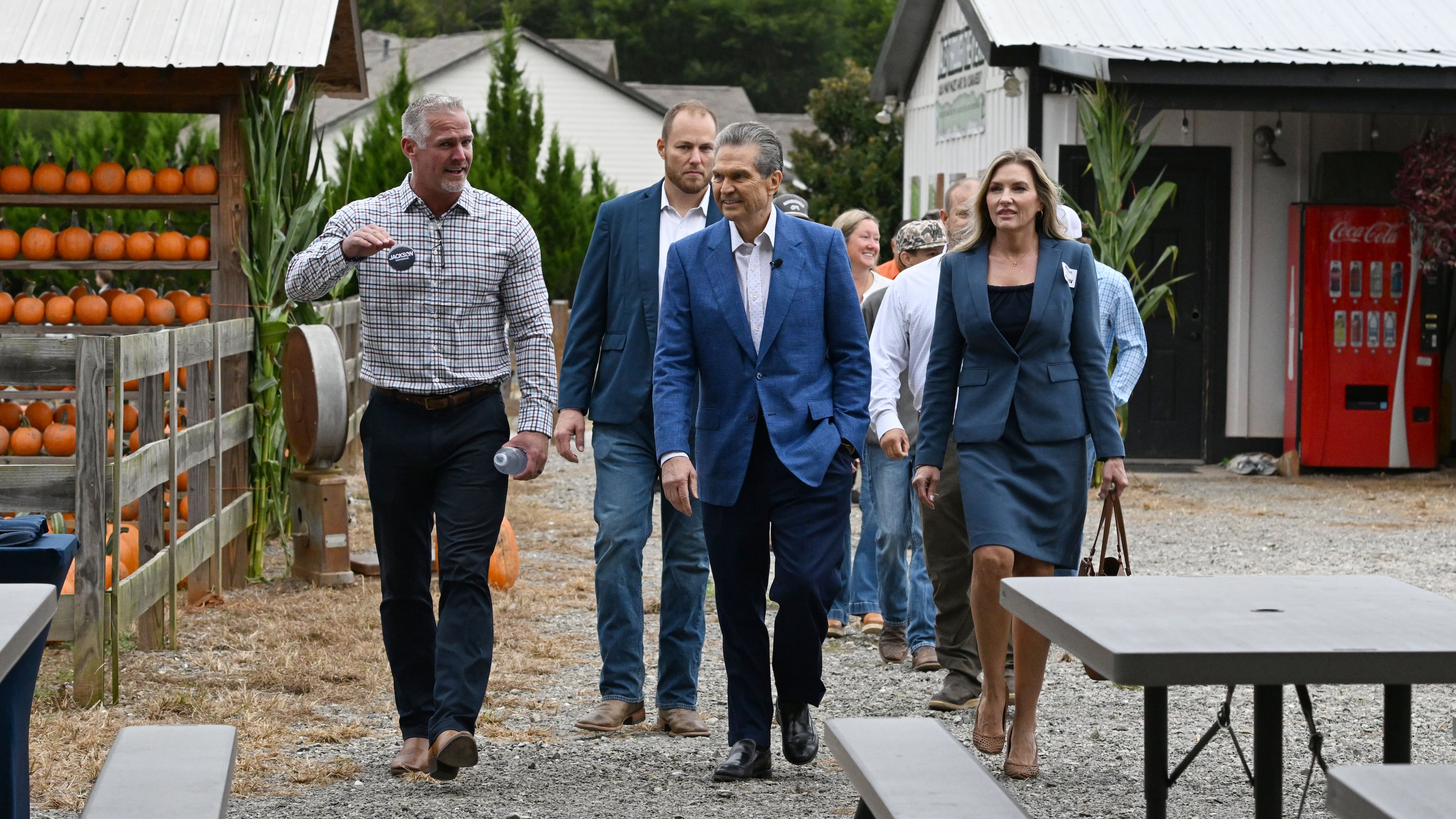 Georgia gubernatorial candidate Rick Jackson, center, arrives with local farmers and government officials supporting his campaign during an event announcing his plan to support Georgia farmers at Cagle's Family Farm on Thursday, Sept. 24, 2026, in Canton. (Hyosub Shin/AJC)