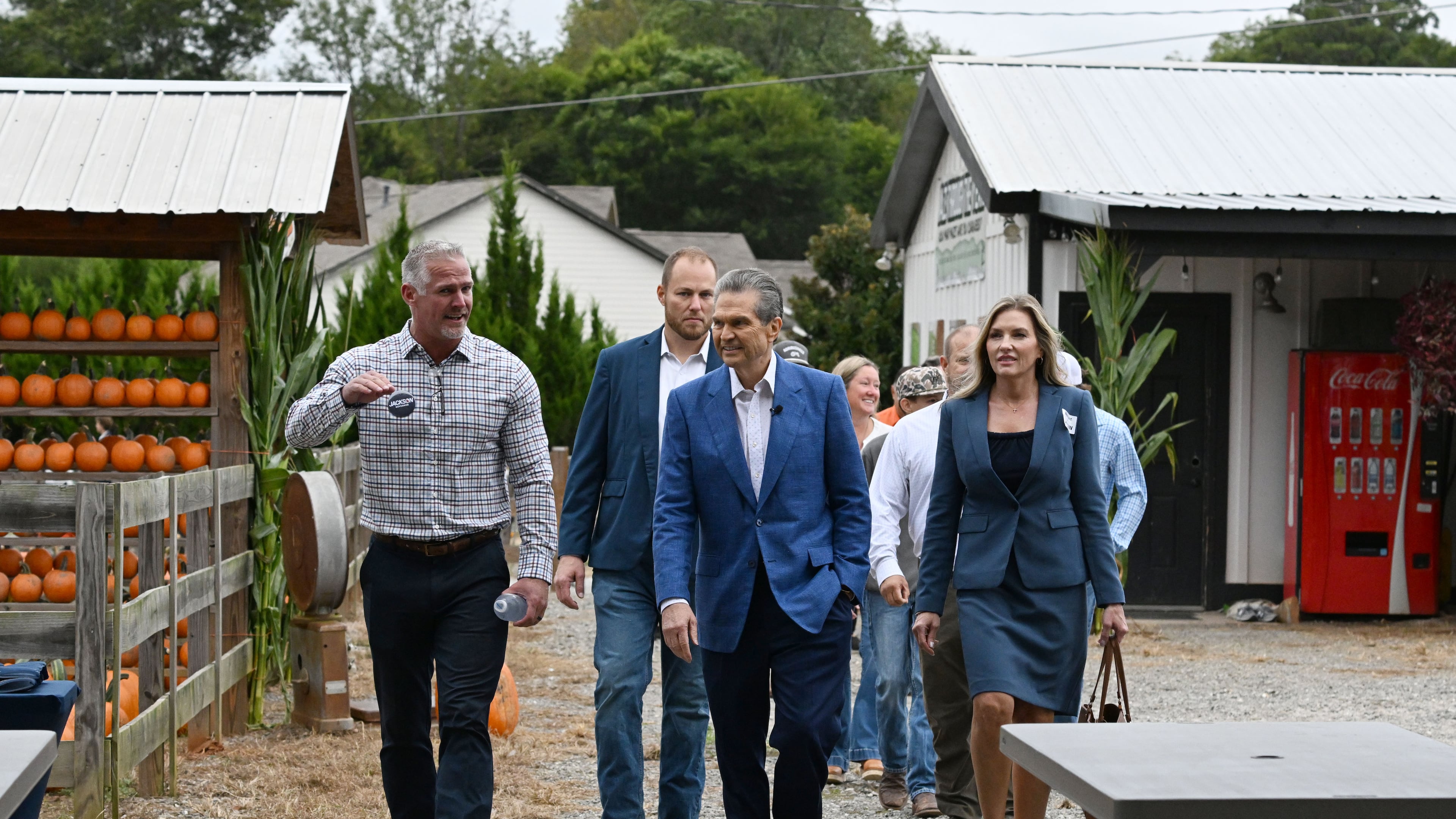 Georgia gubernatorial candidate Rick Jackson, center, arrives with local farmers and government officials supporting his campaign during an event announcing his plan to support Georgia farmers at Cagle's Family Farm on Thursday, Sept. 24, 2026, in Canton. (Hyosub Shin/AJC)