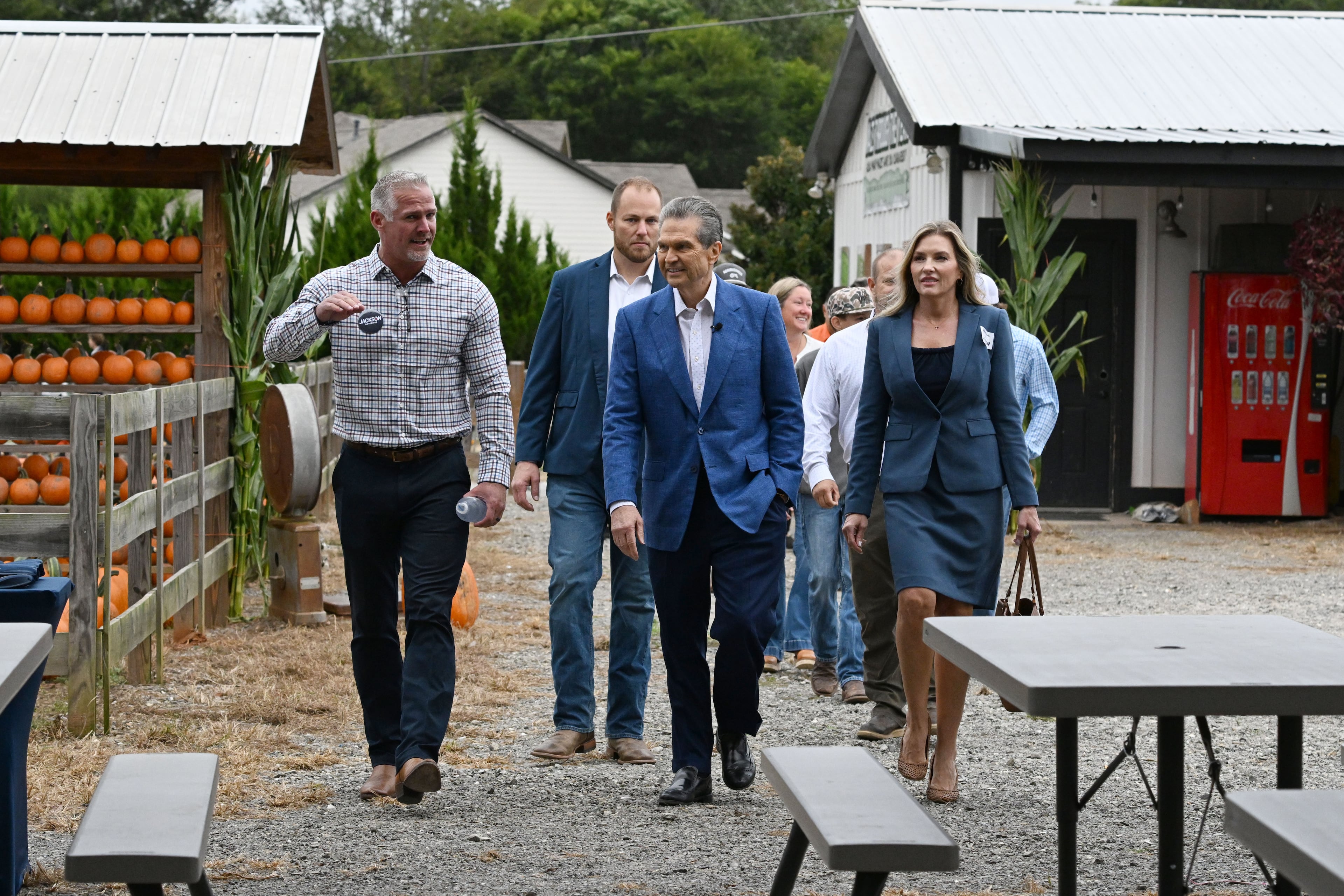 Georgia gubernatorial candidate Rick Jackson, center, arrives with local farmers and government officials supporting his campaign during an event announcing his plan to support Georgia farmers at Cagle's Family Farm on Thursday, Sept. 24, 2026, in Canton. (Hyosub Shin/AJC)