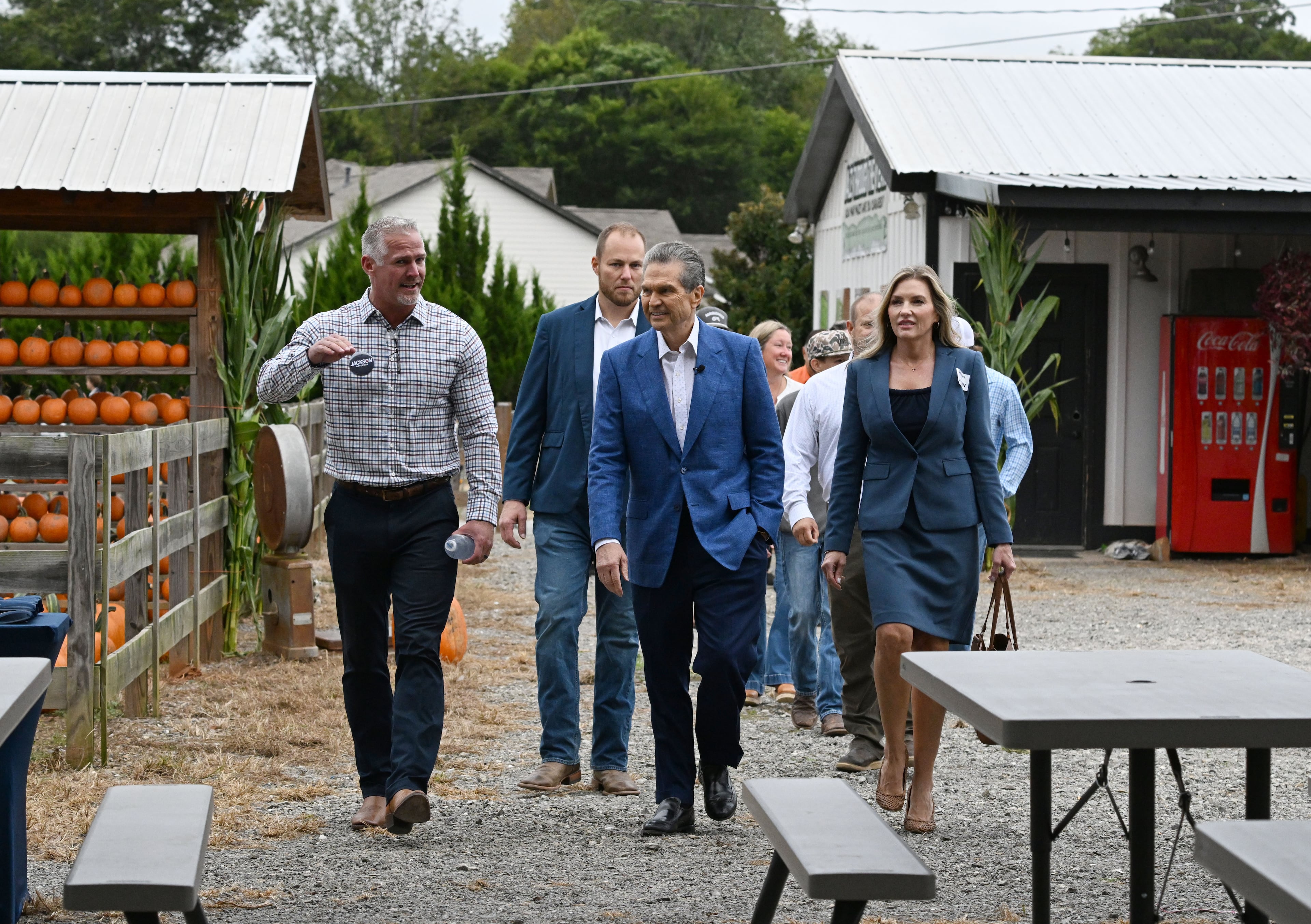 Georgia gubernatorial candidate Rick Jackson, center, arrives with local farmers and government officials supporting his campaign during an event announcing his plan to support Georgia farmers at Cagle's Family Farm on Thursday, Sept. 24, 2026, in Canton. (Hyosub Shin/AJC)