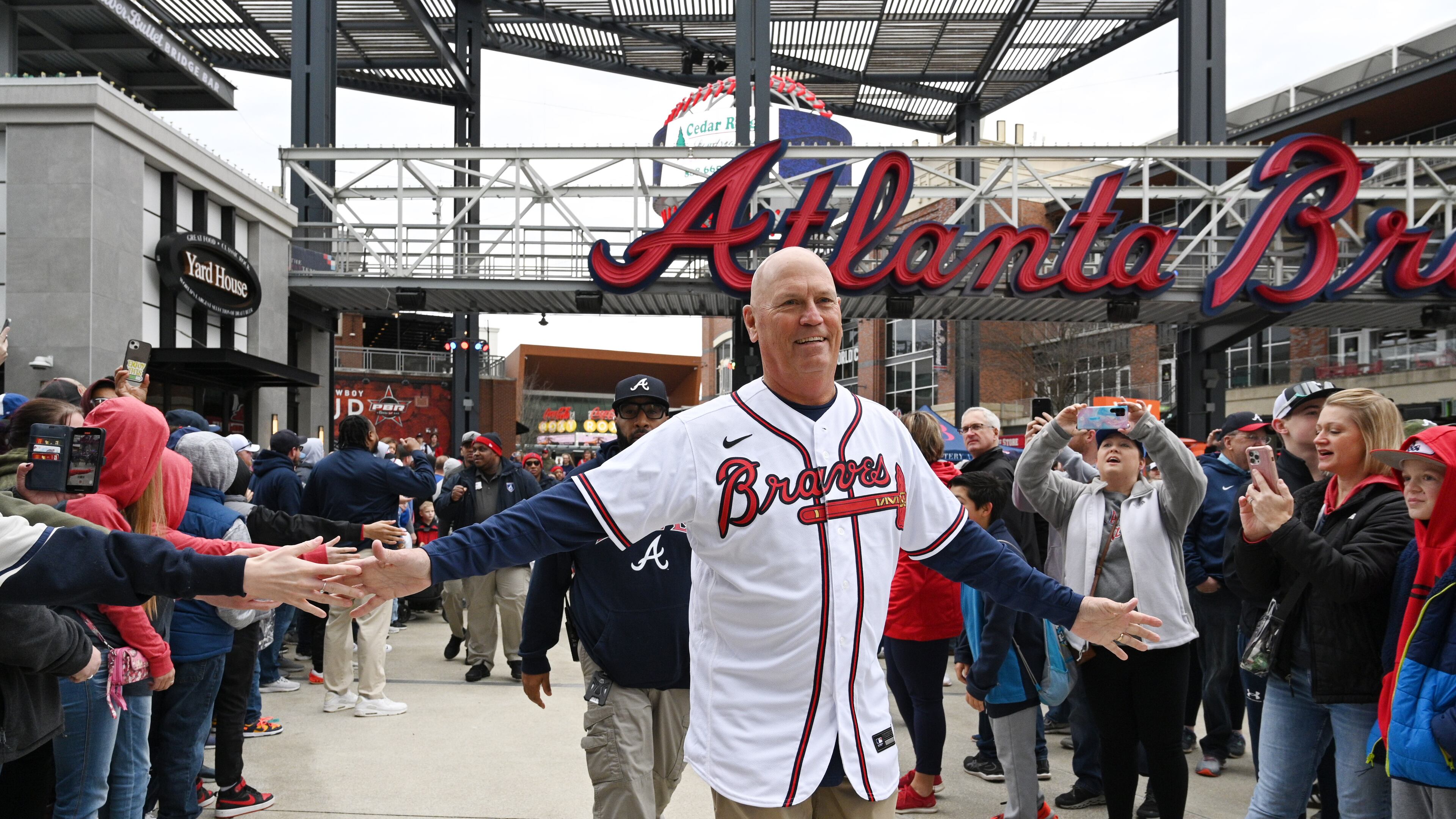 Braves manager Brian Snitker greets fans as he and players walk to Georgia Power Pavilion Stage during Braves Fest Opening Rally at The Battery Atlanta, Saturday, Jan. 21, 2023, in Atlanta. (Hyosub Shin / Hyosub.Shin@ajc.com)
