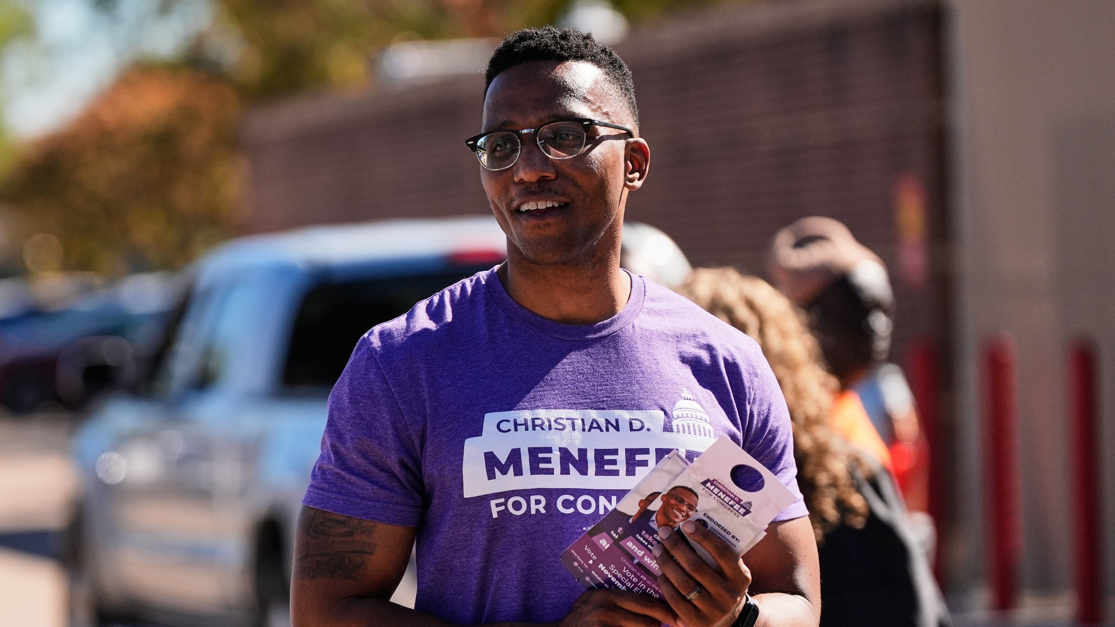 FILE - Democratic 18th Congressional District candidate Christian Menefee greets voters near a polling place on Nov. 4, 2025, in Houston. (AP Photo/Ashley Landis, file)