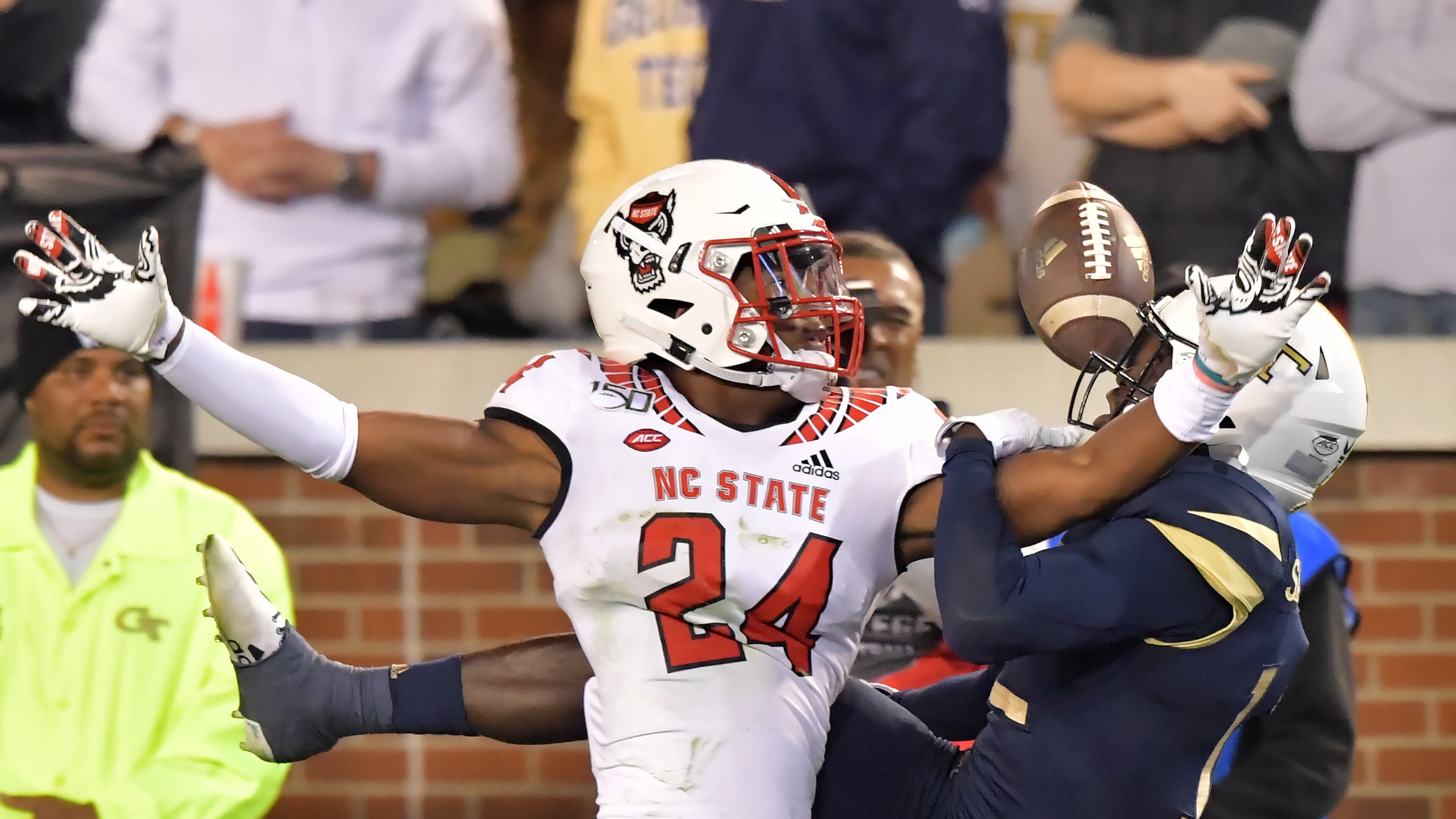 North Carolina State cornerback Malik Dunlap (24) collides with Georgia Tech wide receiver Adonicas Sanders (12) as he blocks a pass Nov. 21, 2019, at Bobby Dodd Stadium in Atlanta. The two schools meet Dec. 5, 2020, in Raleigh, N.C.