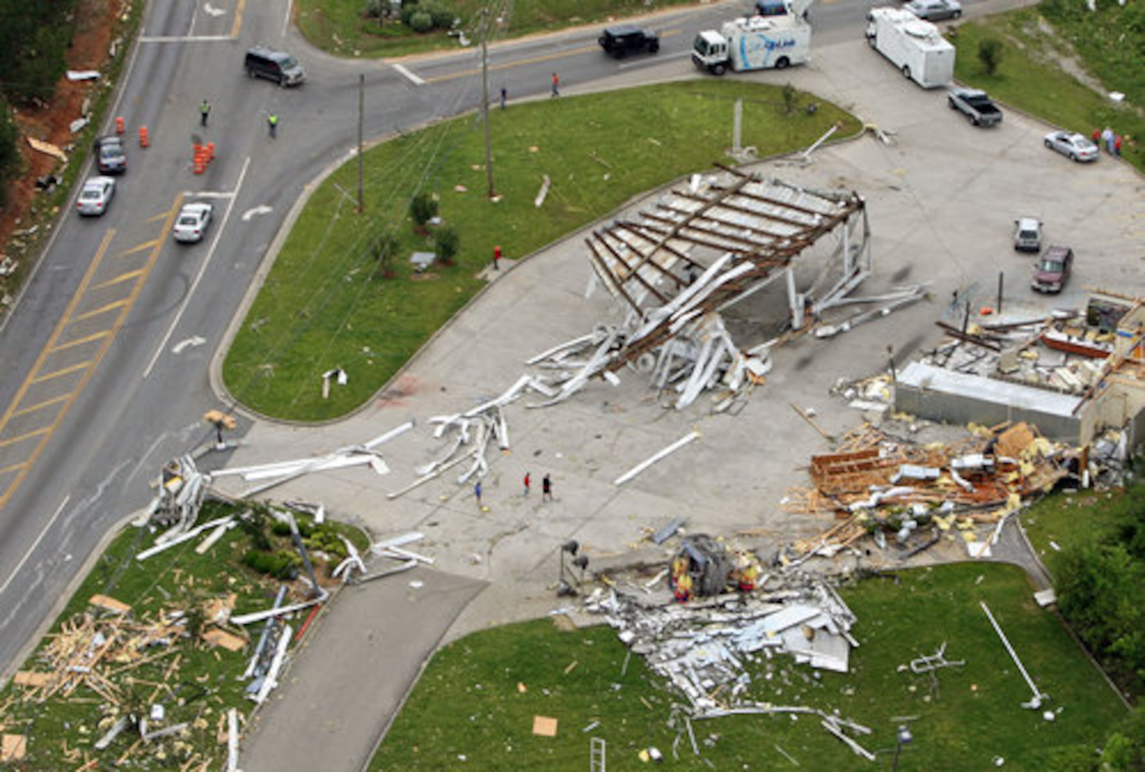 The tornado destroyed a gas station as police block off the debris-filled roads Thursday afternoon in Ringgold, Ga.