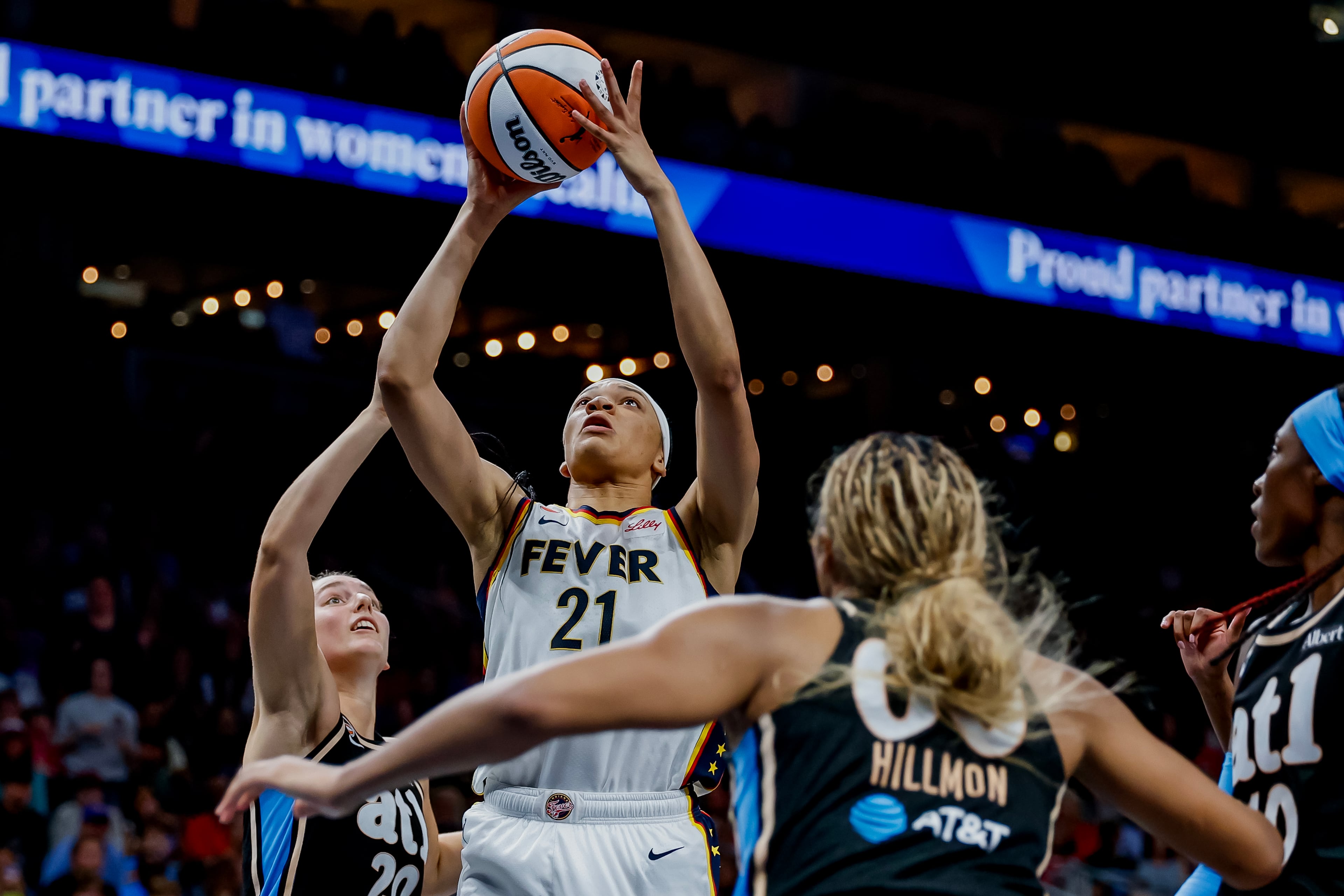 Fever forward Makayla Timpson scores against Dream guard Isobel Borlase (left) and forward Naz Hillmon during overtime. (Erik S. Lesser for the AJC)