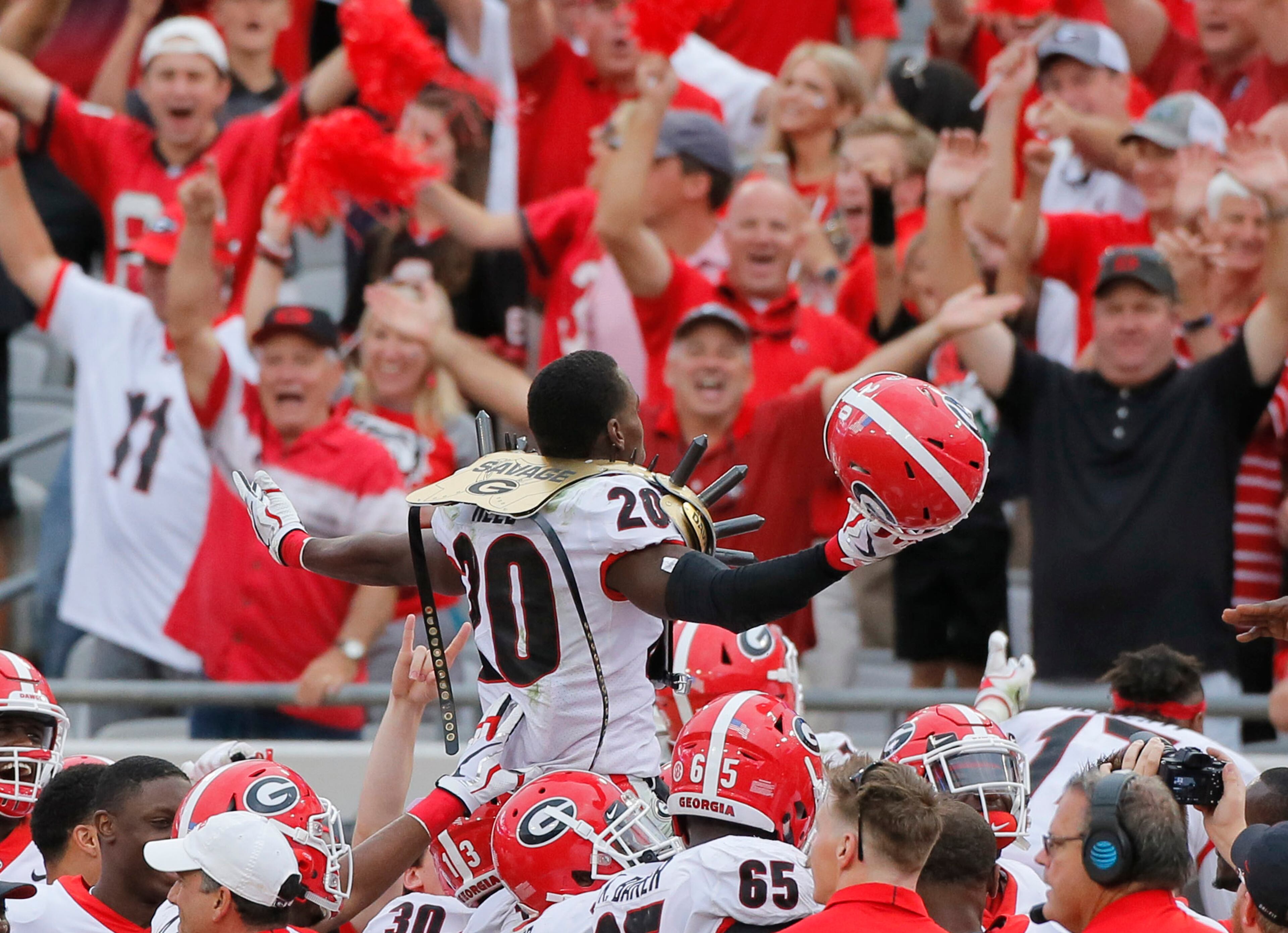 10/28/17 - Jacksonville, FL - Georgia Bulldogs defensive back J.R. Reed (20) is lifted above his teammates after he scored on a sack and fumble by Florida's quarterback. NCAA football game between Georgia and Florida at EverBank Field in Jacksonville. Georgia defeated Florida 42-7. BOB ANDRES /BANDRES@AJC.COM BOB ANDRES /BANDRES@AJC.COM