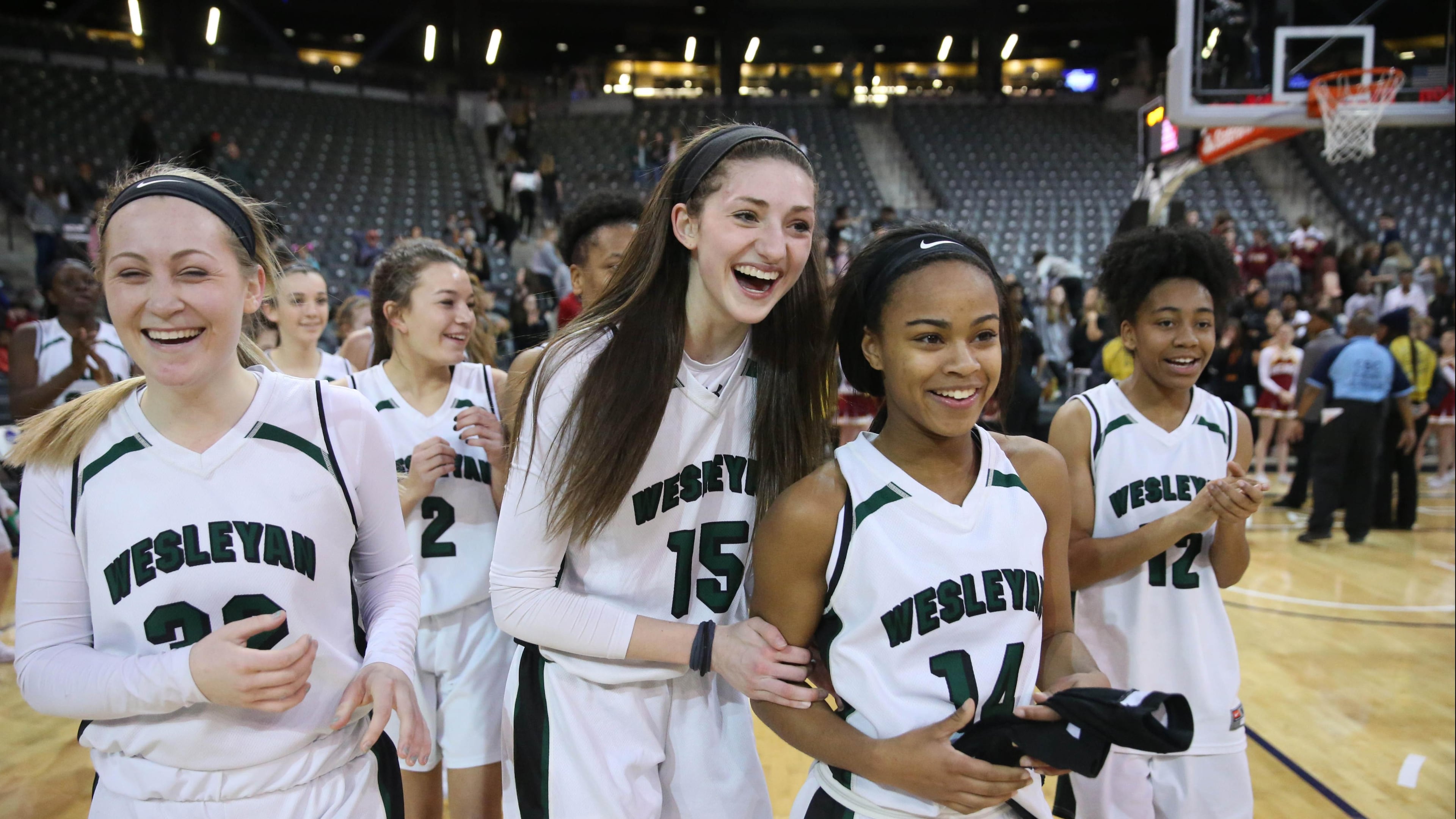 March 9, 2018 - Atlanta, Ga: Wesleyan's Callie Weaver (32), Sutton West (15), Amaya Register (14), and Paige Lyons (12) celebrate their win against Holy Innocents during the GHSA Class A Private Girls State Championship at McCamish Pavilion Friday, March 9, 2018, in Atlanta. Wesleyan won 61-44. PHOTO / JASON GETZ