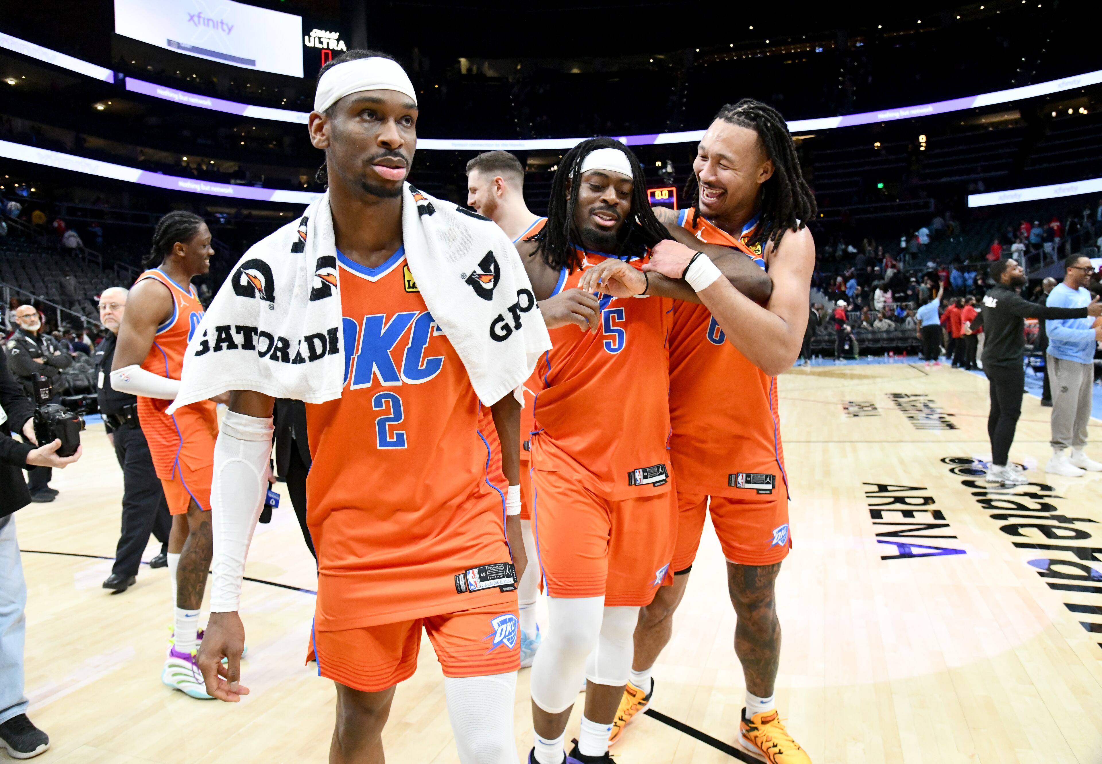 Oklahoma City Thunder (from left) guard Shai Gilgeous-Alexander, guard Luguentz Dort, and forward Jaylin Williams react after Oklahoma City Thunder beat Atlanta Hawks during an NBA basketball game at State Farm Arena, Friday, February 28, 2025, in Atlanta. Oklahoma City Thunder won 135-119 over Atlanta Hawks. (Hyosub Shin / AJC)