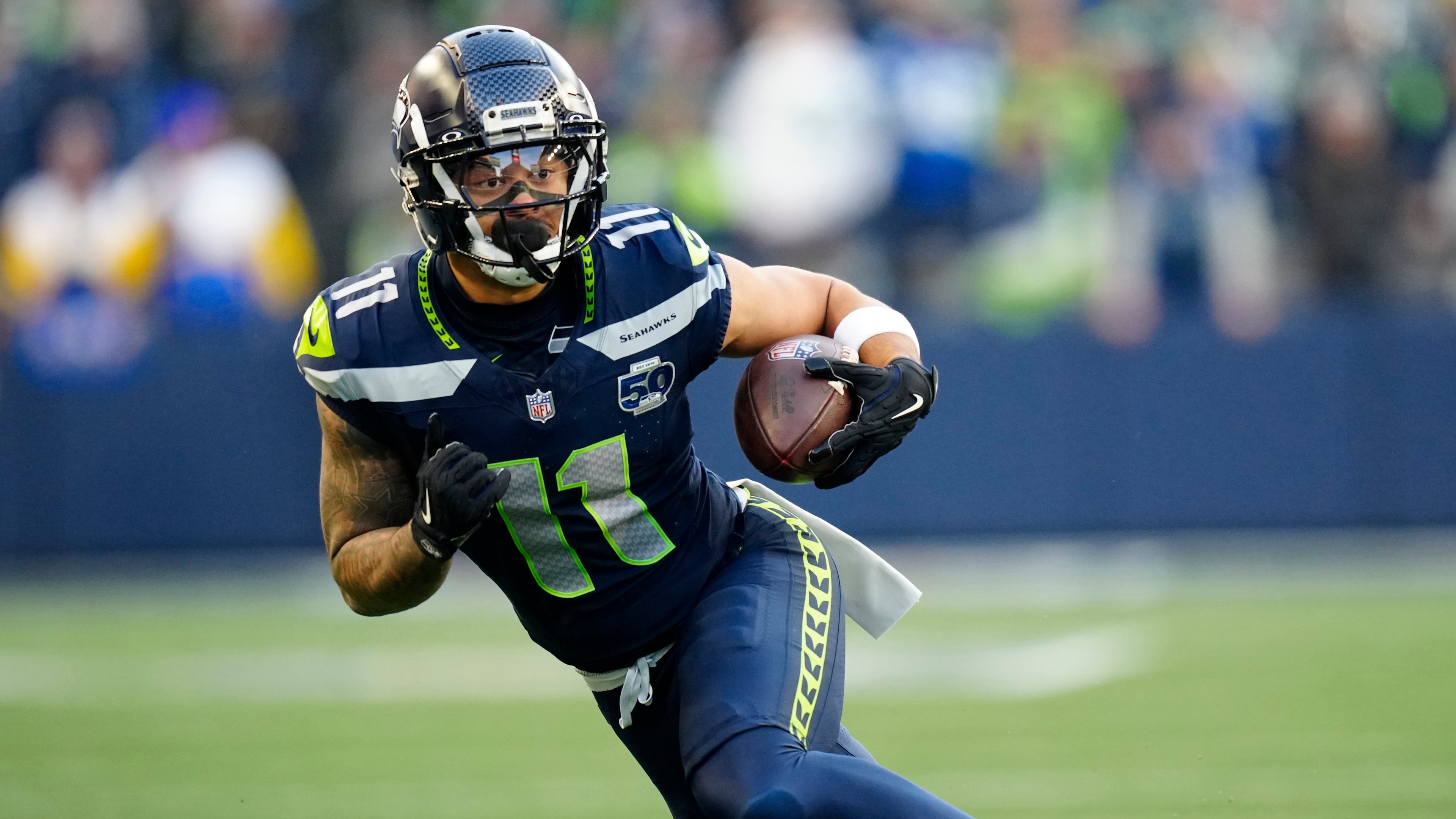 FILE - Seattle Seahawks wide receiver Jaxon Smith-Njigba (11) runs with the ball during the NFC Championship NFL football game Jan. 25, 2026, in Seattle. (AP Photo/Ben VanHouten, File)