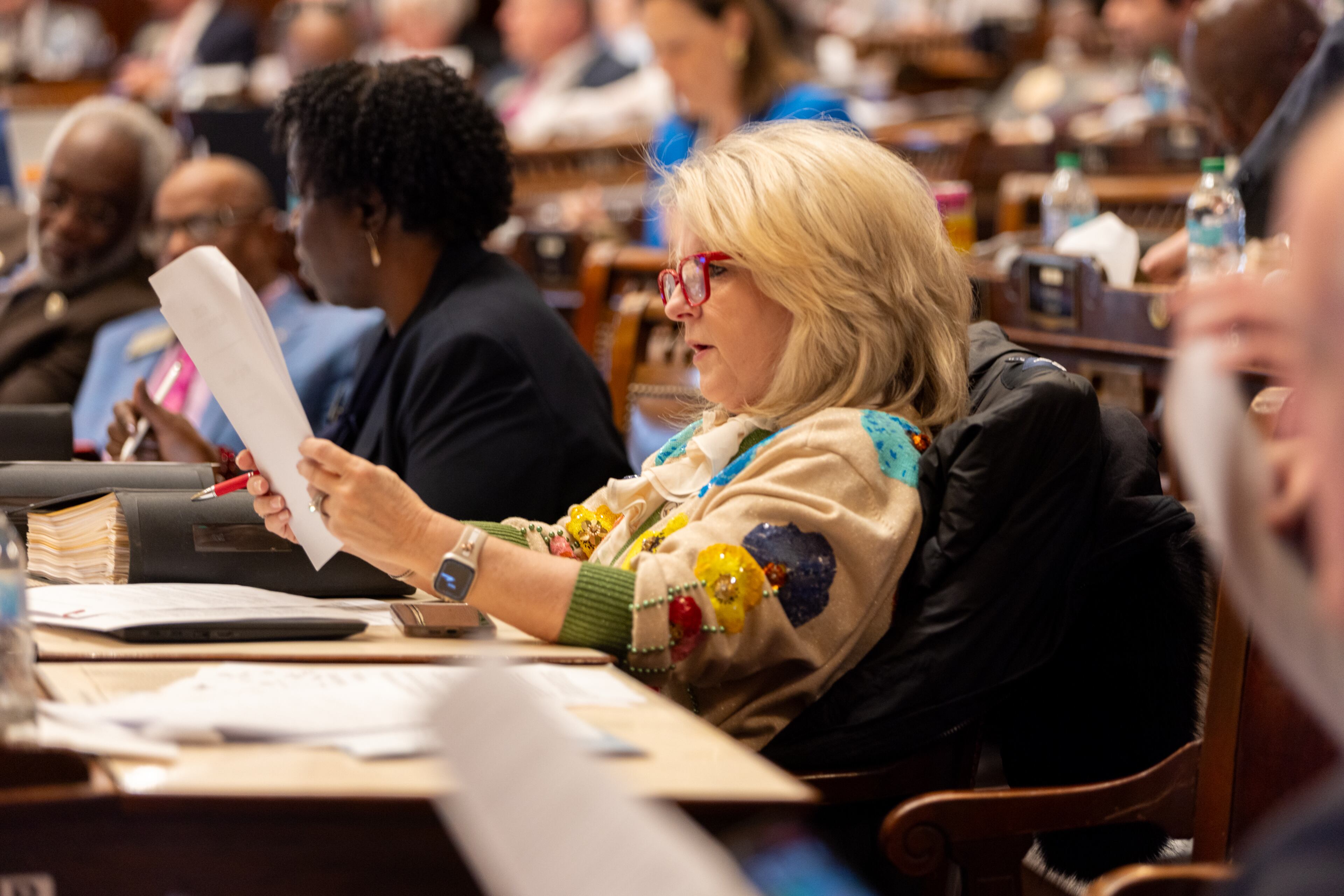 State Rep. Angie O’Steen, R-Ambrose, reviewed a bill in the House of Representatives at the Capitol in Atlanta on Crossover Day, Thursday, March 6, 2025. (Arvin Temkar/AJC)