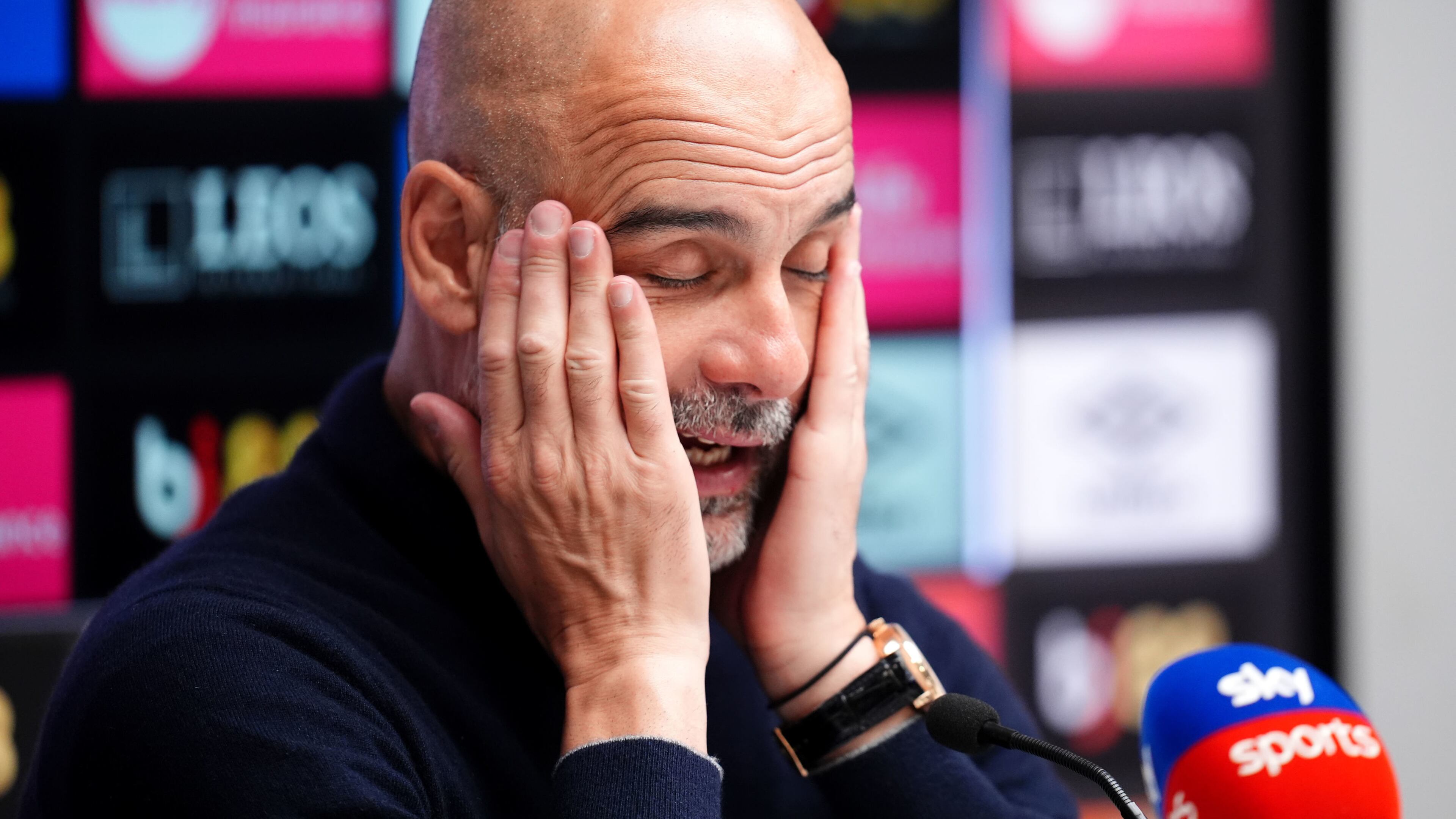 Manchester City manager Pep Guardiola rubs his face as he speaks to the media during a press conference following the English Premier League soccer match between AFC Bournemouth and Manchester City in Bournemouth, England, Tuesday, May 19, 2026. (John Walton/PA via AP)