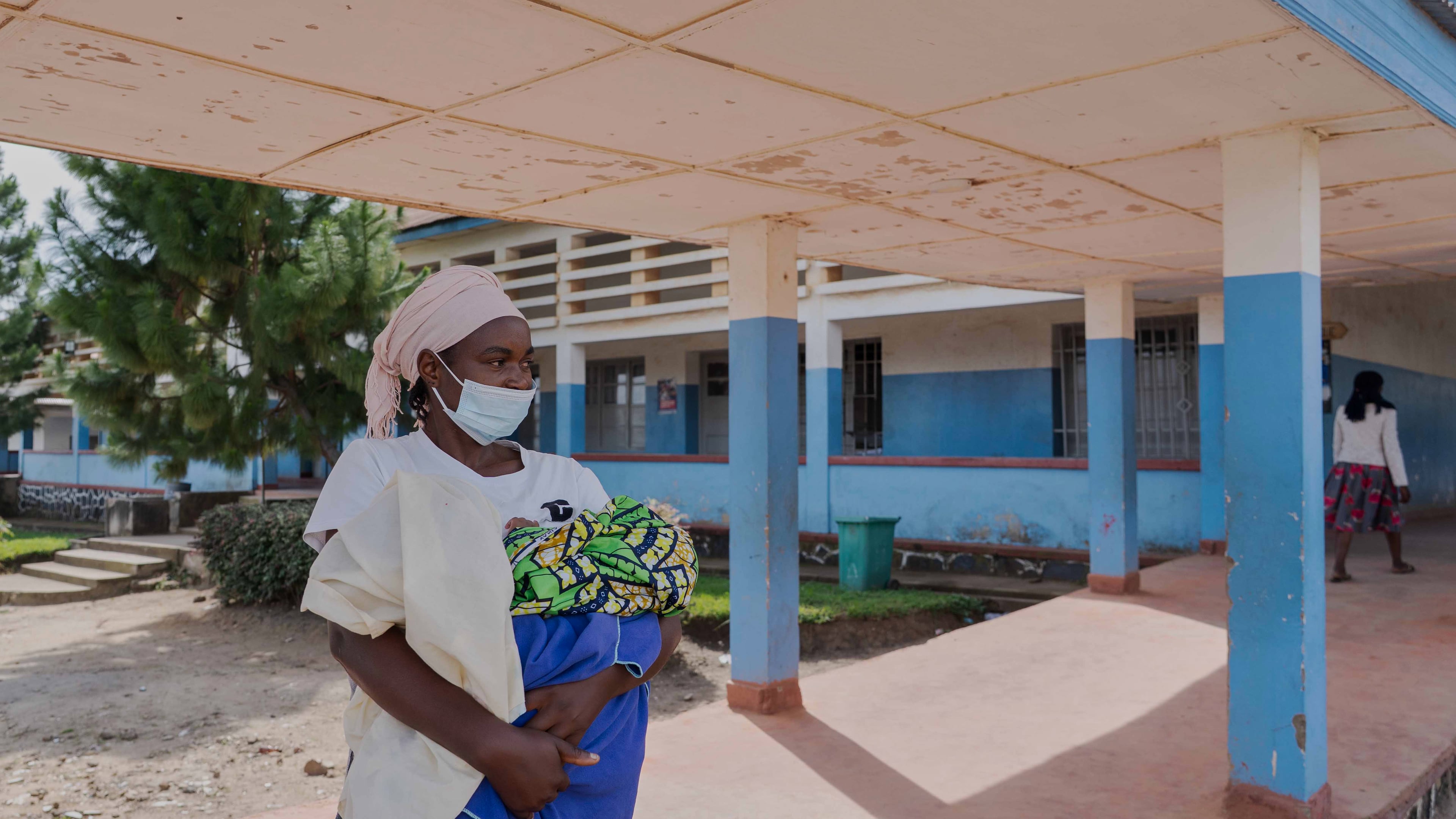 A woman wearing a protective mask stands in the corridor of a hospital in Bunia, Congo, Sunday, May 17, 2026. (AP Photo/ Dirole Lotsima Dieudonne)