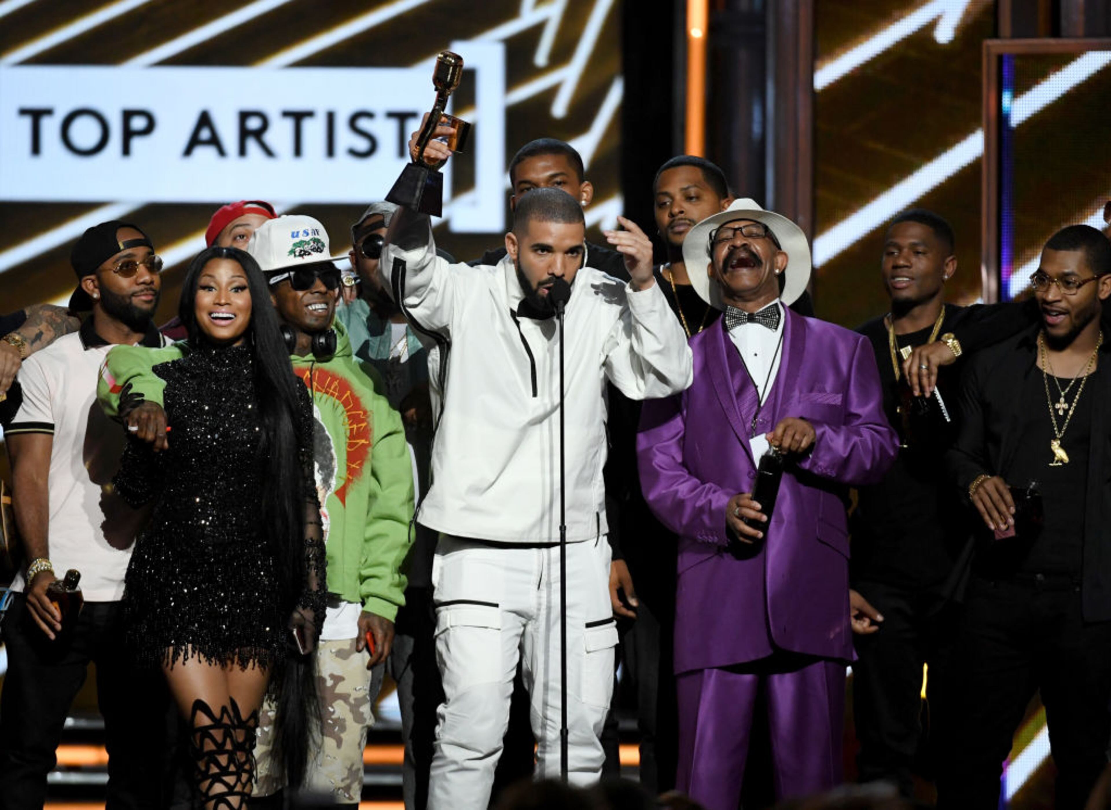 LAS VEGAS, NV - MAY 21: Rapper Drake (C) accepts the Top Artist award onstage with songwriters, producers and father Dennis Graham during the 2017 Billboard Music Awards at T-Mobile Arena on May 21, 2017 in Las Vegas, Nevada. (Photo by Ethan Miller/Getty Images)