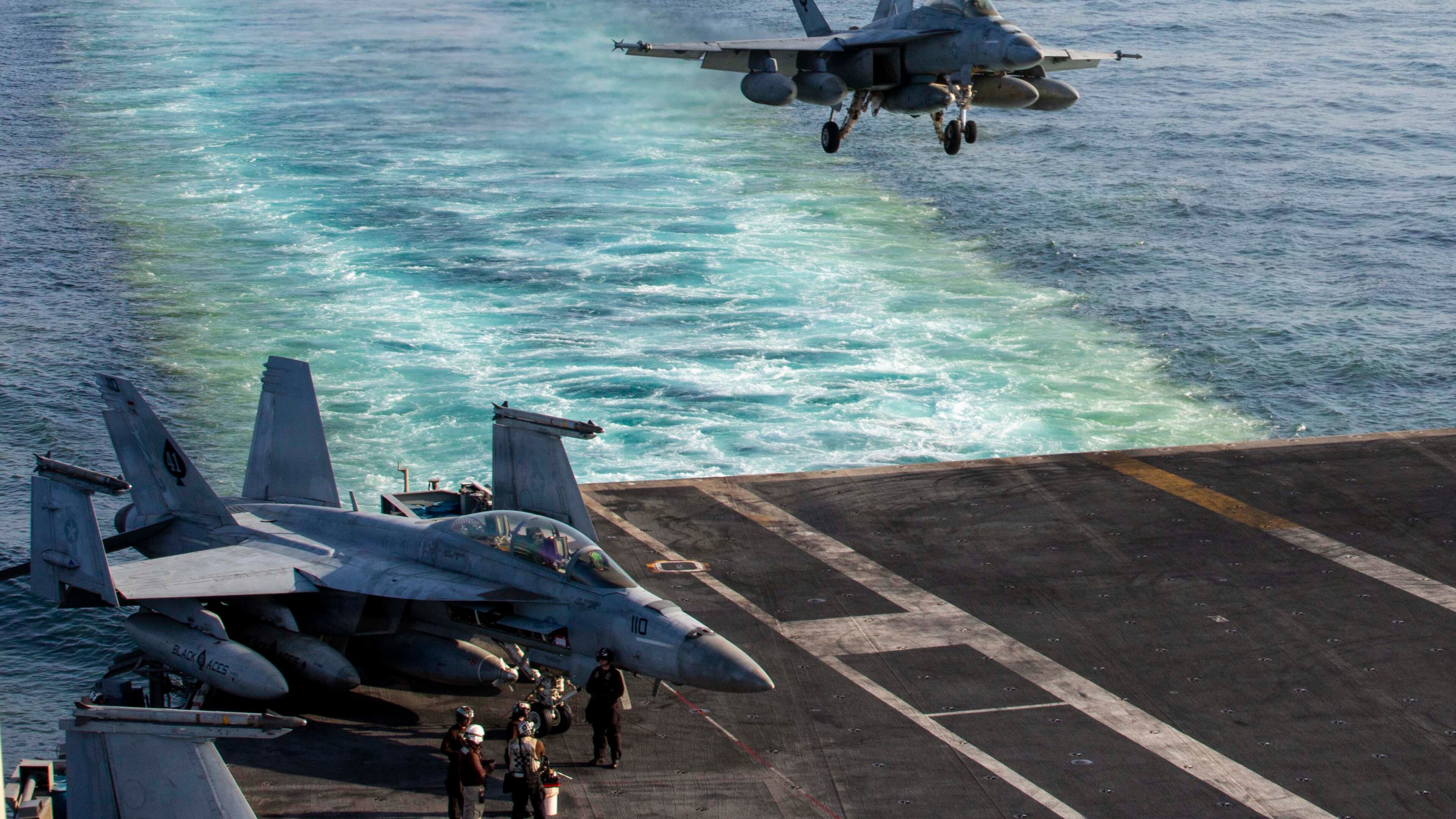 This image provided by U.S. Central Command shows a F/A-18E Super Hornet preparing to make an arrested landing on the USS Abraham Lincoln (CVN 72) after a mission in support of Operation Epic Fury, on Saturday, Feb. 28, 2026. (U.S. Navy via AP)