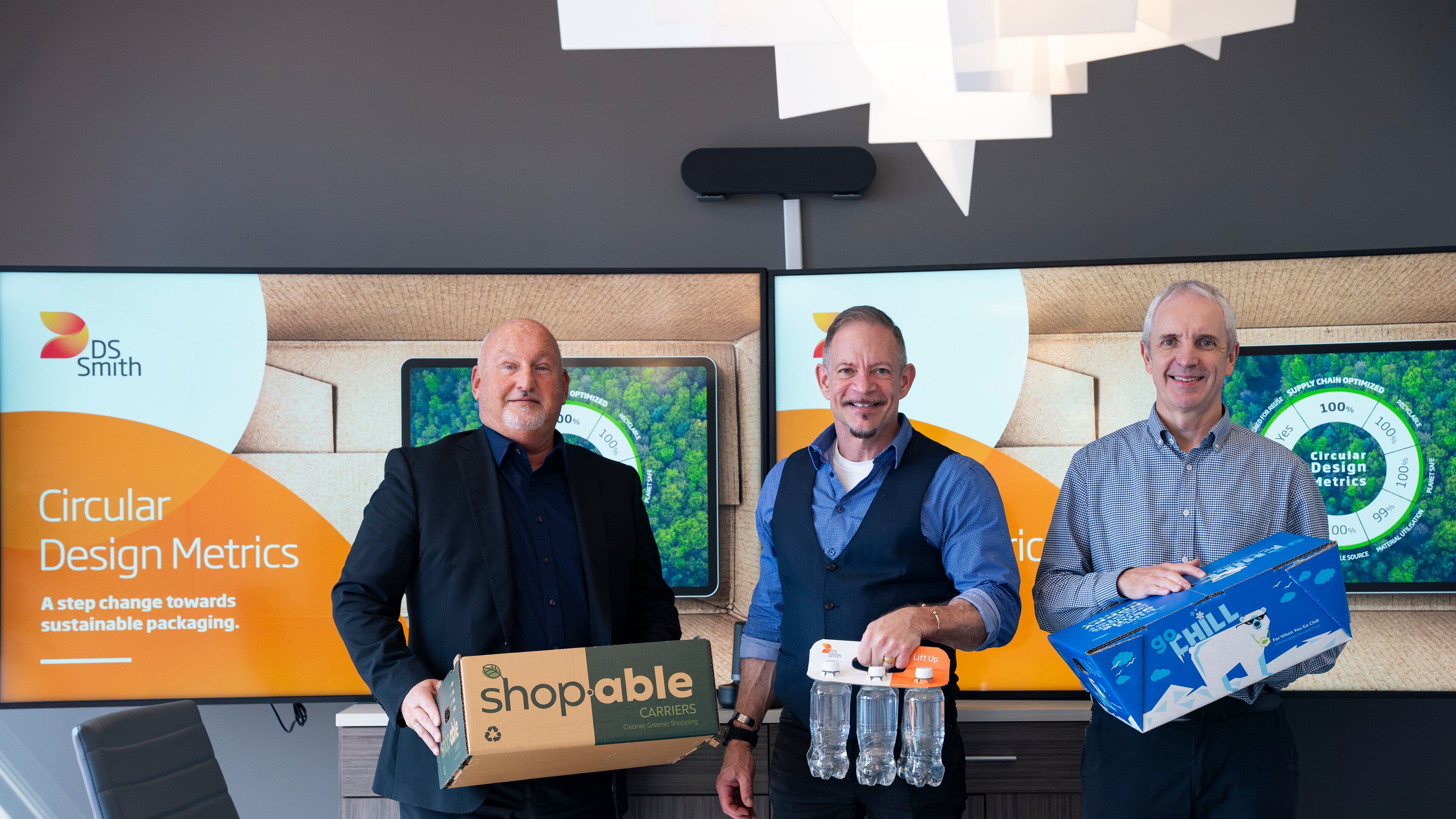 David McCracken, Business Unit Director at DS Smith (left), Jeff Jones, Business Services and Corporate Services Director (center), and Steven Rose, Managing Director of Packaging (right), display the company’s sustainable packaging innovations at their U.S. headquarters in Atlanta, Thursday, Oct. 3, 2024. DS Smith, a British-based packaging company with a focus on environmentally friendly solutions, is in talks to be acquired by International Paper for $7 billion. The acquisition aims to enhance sustainability efforts in the packaging industry. (Olivia Bowdoin for the AJC)